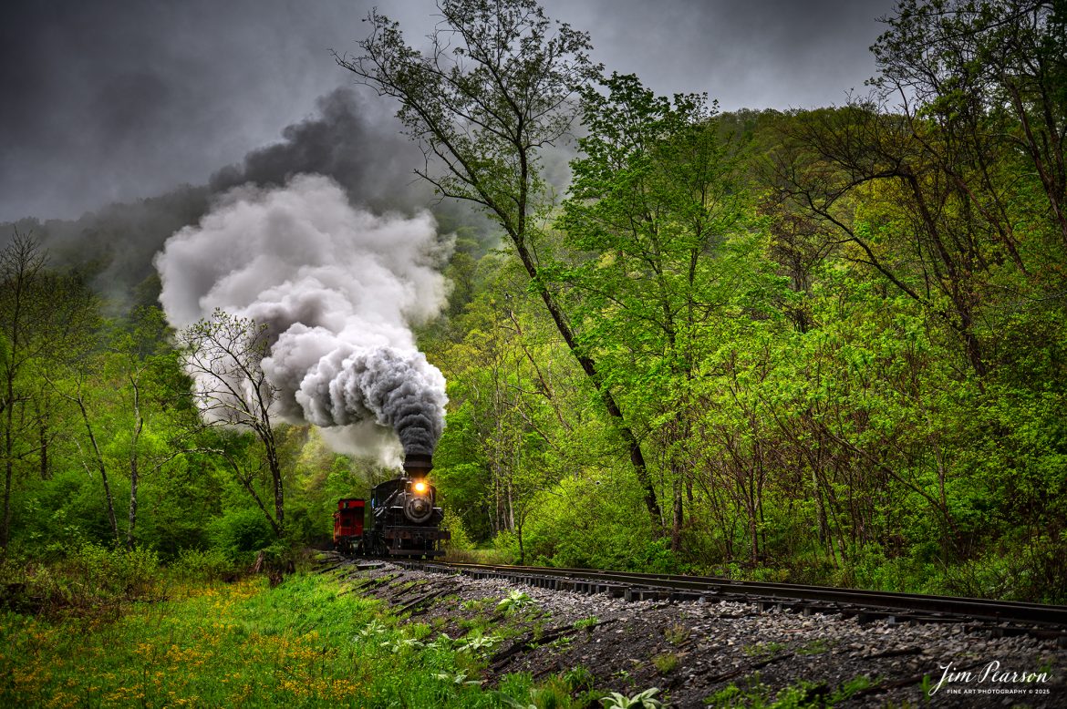 Engineer Noah Barkley keeps a watchful eye on the track ahead from Cass Scenic Railway Heisler #6 as they pull through the countryside at Wanless on the way to Durban, West Virginia, during the Cass Spring Photographers Special, from Cass, West Virginia on May 4th, 2025. 

According to the Mountain Rail West Virginia Website: The Meadow River Lumber No. 6 was built by the Heisler Locomotive Works in Erie, PA, in 1929 for the Bostonia Coal & Clay Products Company of New Bethlehem, PA.

The Heisler was sold to the Meadow River Lumber Company at Rainelle, WV in 1939, where it was rostered as No. 6. She retired from the lumber company in 1965 and was purchased by the purchased it by the state of West Virginia purchased. The engine ran under its own steam from Rainelle to its new home in Cass in December 1966. No. 6 would begin operating on the railroad in 1968. The Heisler is the fastest geared locomotive in the Cass collection.

Tech Info: Nikon Z6ii, RAW, Nikon 24-70 @ 52mm, f/2.8, 1/160, ISO 100.

#railroad #railroads #train, #trains #railway #railway #railtransport #railroadengines #picturesoftrains #picturesofrailways #besttrainphotograph #bestphoto #photographyoftrains #bestsoldpicture #JimPearsonPhotography #steamtrain #casssenicrailway