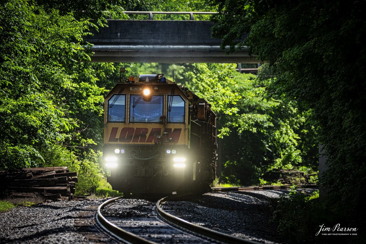 LORAM Railgrinder 56 passes under an overpass as it heads south at Dawson Springs, Kentucky,on the Paducah and Louisville Railway, on June 5th, 2025.

According to Wikipedia: A rail grinder (or rail grinder) is a maintenance of way vehicle or train used to restore the profile and remove irregularities from worn tracks to extend its life and to improve the ride of trains using the track.

Tech Info: Nikon D810, RAW, Nikon 70-300 @ 300mm, f/5.6, 1/1600, ISO 800.

#railroad #railroads #train, #trains #railway #railway #steamtrains #railtransport #railroadengines #picturesoftrains #picturesofrailways #besttrainphotograph #bestphoto #photographyoftrains #bestsoldpicture #JimPearsonPhotography #Brightline #passengertrains #trainsfromtheair #trainsfromadrone #loram