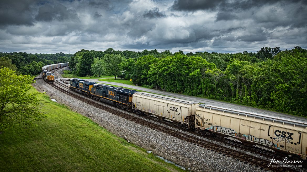 CSX I025 hot intermodal with a long string of autoracks carrying Tesla vehicles meets empty grain train G342 at the north end of the siding at Kelly, Kentucky as they head south on the CSX Henderson Subdivision on June 14th, 2025.

Tech Info: DJI Mavic 3 Classic Drone, RAW, 24mm, f/2.8, 1/3200, ISO 210.

#railroad #railroads #train, #trains #railway #railway #steamtrains #railtransport #railroadengines #picturesoftrains #picturesofrailways #besttrainphotograph #bestphoto #photographyoftrains #bestsoldpicture #JimPearsonPhotography #trainsfromtheair #trainsfromadrone #csxhendersonsubdivision #onecsx