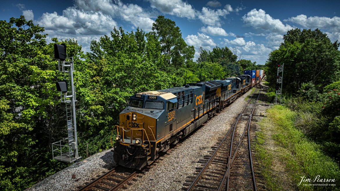 CSXT 3309 leads hot intermodal I026 as they spit the signals at the south end of Atkinson Yard at Madisonville, Kentucky, on the CSX Henderson Subdivision, on July 12th, 2025. 

Tech Info: DJI Mavic 3 Classic Drone, RAW, 22mm, f/2.8, 1/2500, ISO 100.

#railroad #railroads #train, #trains #railway #railway #steamtrains #railtransport #railroadengines #picturesoftrains #picturesofrailways #besttrainphotograph #bestphoto #photographyoftrains #bestsoldpicture #JimPearsonPhotography #trainsfromtheair #trainsfromadrone