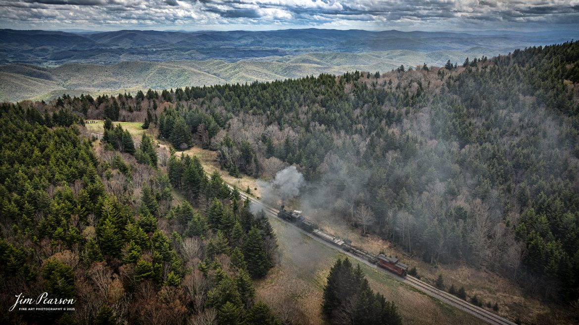 Cass Scenic Railroad Heisler#6 pulls up the hill approaching Bald Knob, WV during the Cass Spring Photographers Special, from Cass, West Virginia on May 3rd, 2025. 

According to the Mountain Rail West Virginia Website: The Meadow River Lumber No. 6 was built by the Heisler Locomotive Works in Erie, PA, in 1929 for the Bostonia Coal & Clay Products Company of New Bethlehem, PA.

The Heisler was sold to the Meadow River Lumber Company at Rainelle, WV in 1939, where it was rostered as No. 6. She retired from the lumber company in 1965 and was purchased by the purchased it by the state of West Virginia purchased. The engine ran under its own steam from Rainelle to its new home in Cass in December 1966. No. 6 would begin operating on the railroad in 1968. The Heisler is the fastest geared locomotive in the Cass collection.

Tech Info: DJI Mavic 3 Classic Drone, RAW, 24mm, f/2.8, 1/2000, ISO 160.

#railroad #railroads #train, #trains #railway #railway #steamtrains #railtransport #railroadengines #picturesoftrains #picturesofrailways #besttrainphotograph #bestphoto #photographyoftrains #bestsoldpicture #JimPearsonPhotography #trainsfromtheair #trainsfromadrone #steamtrain #casssenicrailway