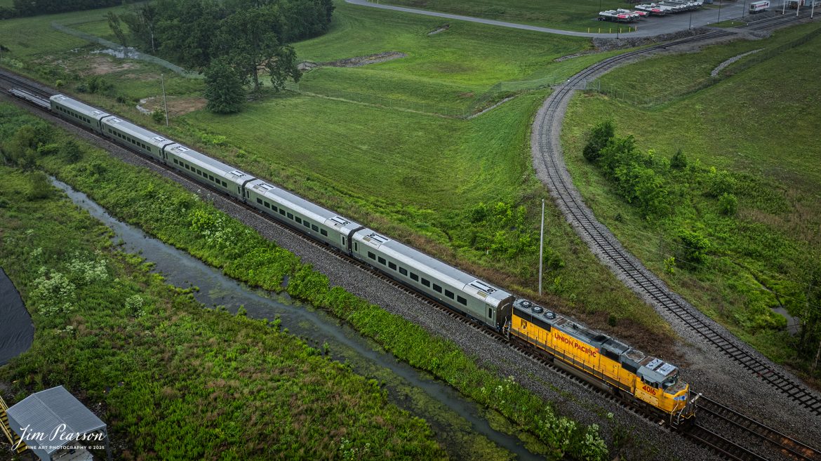 CSX S983, led by Union Pacific 4016, waits for  southbound signal, just short of John Rivers Road crossing at Casky Yard in Hopkinsville, Ky, as it leads 5 new Brightline Cars bound for Florida on May 27th, 2025, on the CSX Henderson Subdivision.

Tech Info: DJI Mavic 3 Classic Drone, RAW, 24mm, f/2.8, 1/800, ISO 100.

#railroad #railroads #train, #trains #railway #railway #steamtrains #railtransport #railroadengines #picturesoftrains #picturesofrailways #besttrainphotograph #bestphoto #photographyoftrains #bestsoldpicture #JimPearsonPhotography #Brightline #passengertrains #trainsfromtheair #trainsfromadrone