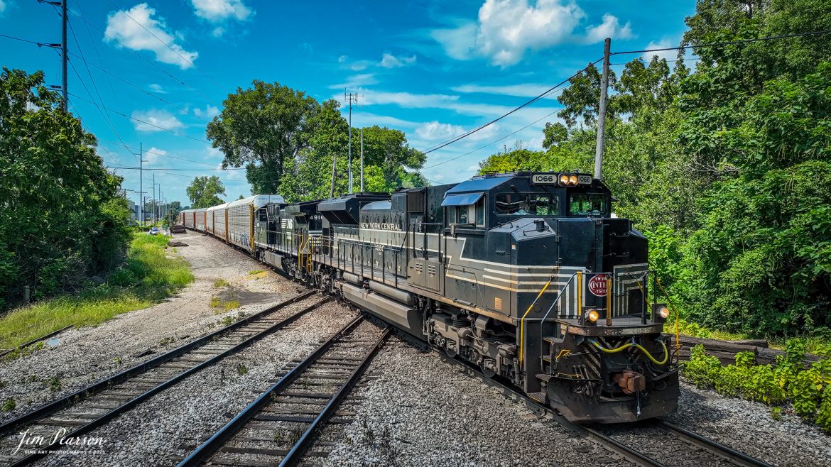 Norfolk Southern New York Central Heritage unit 1066 leads NS 278 northbound across the 4th Street Diamond at Louisville, Kentucky on July 28th, 2025, on the NS Louisville District, crossing over the CSX Louisville Terminal Subdivision.

Tech Info: 4K Frame Grab from a DJI Mavic 3 Classic Drone, RAW, 22mm, f/2.8, 1/2000, ISO 120.

#railroad #railroads #train, #trains #railway #railway #steamtrains #railtransport #railroadengines #picturesoftrains #picturesofrailways #besttrainphotograph #bestphoto #photographyoftrains #bestsoldpicture #JimPearsonPhotography #trainsfromtheair #trainsfromadrone