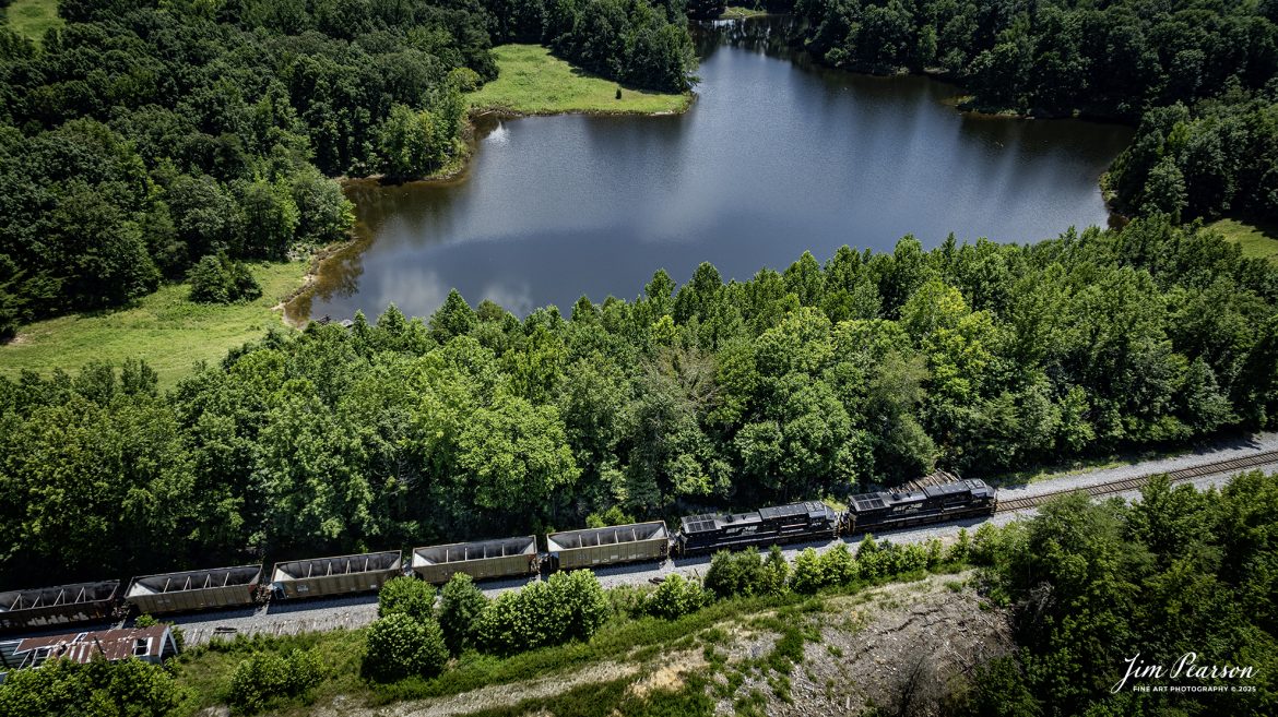 A northbound Norfolk Southern Railway empty coal train passes through the countryside on the Paducah and Louisville Railway at Charleston, Kentucky, on July 29th, 2025, as it heads south past Workman Lake.

Tech Info: DJI Mavic 3 Classic Drone, RAW, 22mm, f/2.8, 1/640, ISO 100

#railroad #railroads #train, #trains #railway #railway #steamtrains #railtransport #railroadengines #picturesoftrains #picturesofrailways #besttrainphotograph #bestphoto #photographyoftrains #bestsoldpicture #JimPearsonPhotography #trainsfromtheair #trainsfromadrone #norfolksouthern