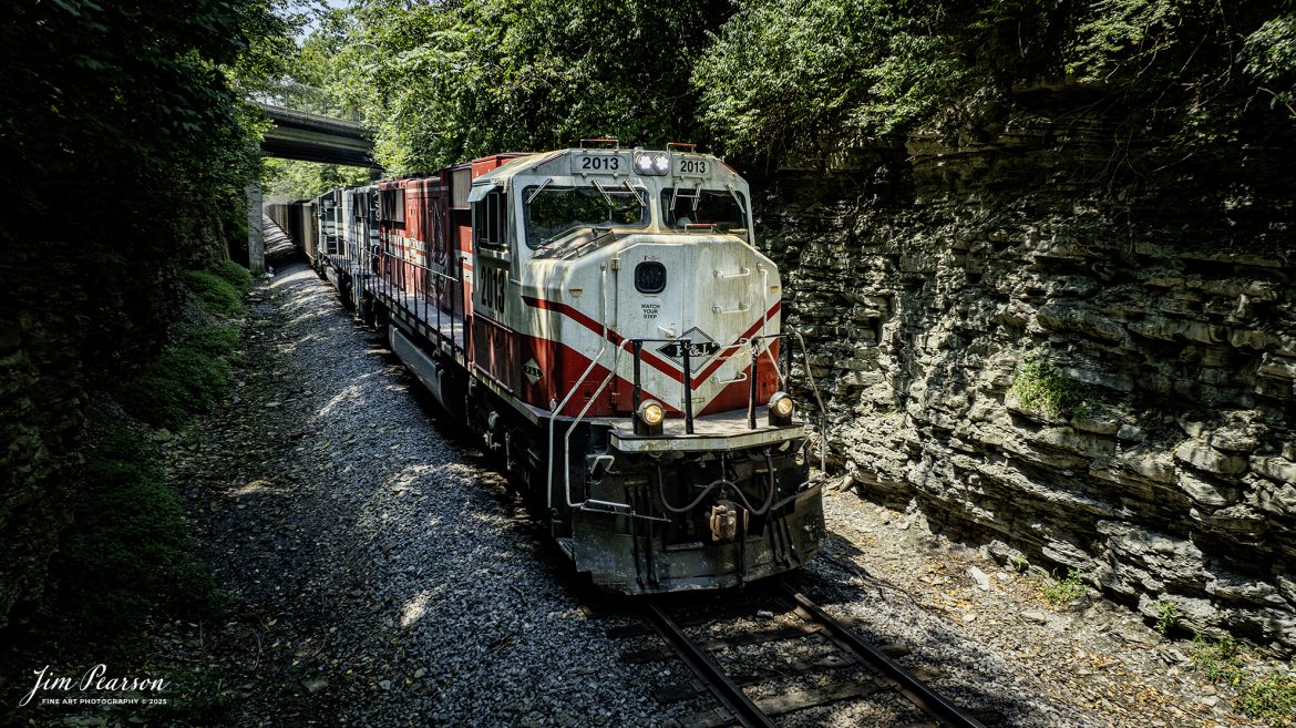 Paducah and Louisville Railway’s University of Louisville locomotive leads the Louisville Gas and Electric loaded coal train north as it passes under the Grapevine Road in Madisonville, Kentucky, on July 30th, 2025.

Tech Info: DJI Mavic 3 Classic Drone, RAW, 22mm, f/2.8, 1/640, ISO 240.

#railroad #railroads #train, #trains #railway #railway #steamtrains #railtransport #railroadengines #picturesoftrains #picturesofrailways #besttrainphotograph #bestphoto #photographyoftrains #bestsoldpicture #JimPearsonPhotography #trainsfromtheair #trainsfromadrone #paducahandlouisvillerailway #pal