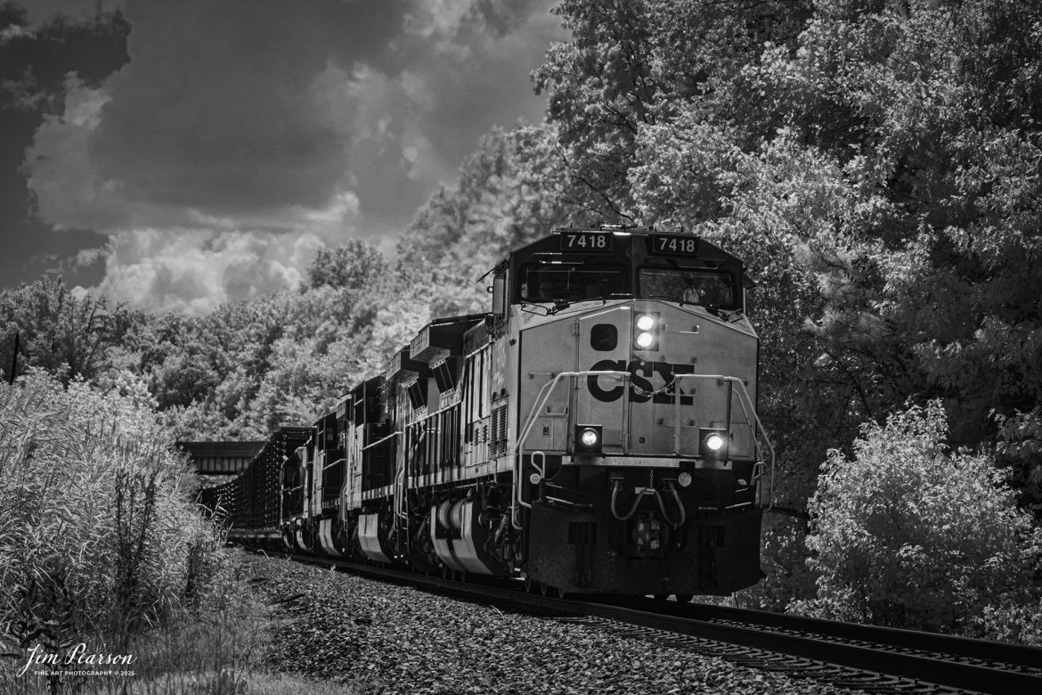 In this week’s Saturday Infrared photo, we catch a CSX 7418 leading CSX M512 with a long string of truck frames, as they pass under the US 41 overpass at Mortons Gap, Ky on their way north on the CSX Henderson Subdivision, on August 7th, 2025.

Tech Info: Fuji XT-1, RAW, Converted to 720nm B&W IR, Nikon 70-300 @70mm, f/4.5, 1/2000, ISO 400.

#trainphotography #railroadphotography #trains #railways #jimpearsonphotography #infraredtrainphotography #infraredphotography #trainphotographer #railroadphotographer #infaredtrainphotography #trending