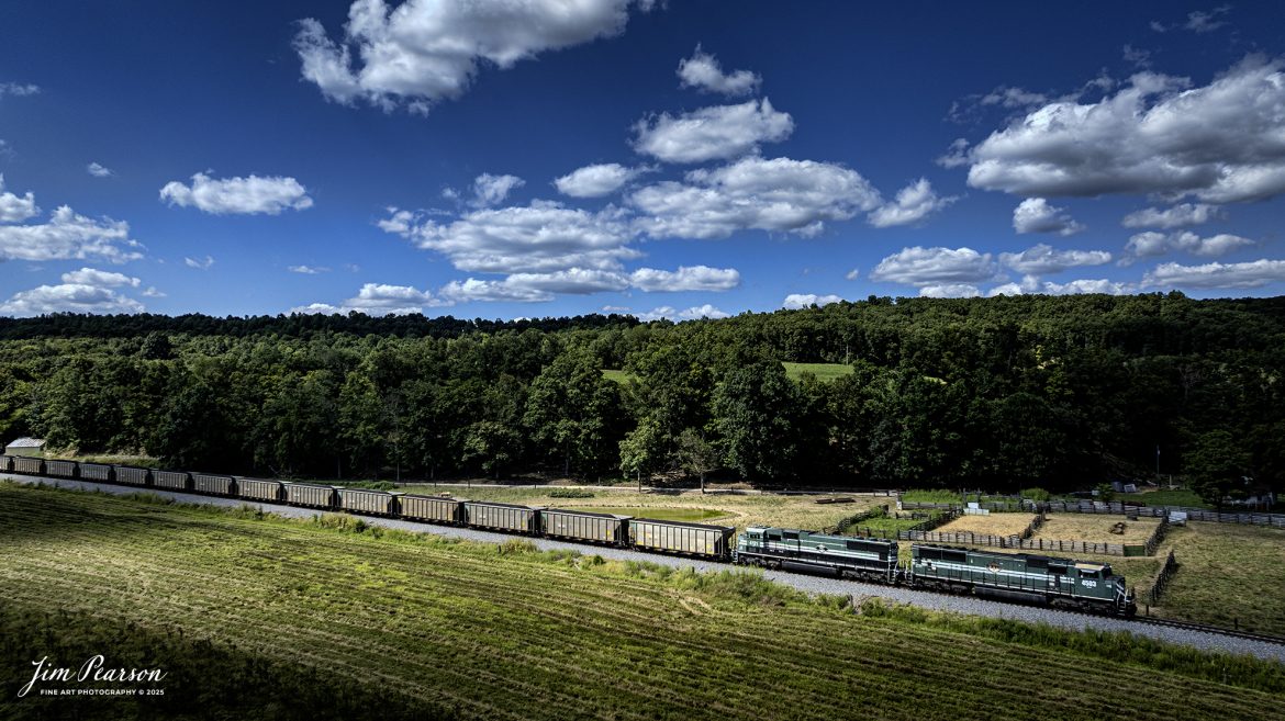 Paducah and Louisville Railway 4503 and 4521 lead a loaded Louisville, Gas and Electric coal train north as they pass through the valley at Do Stop, just south of Caneyville, Kentucky, on August 26th, 2025. 

According to Wikipedia: The Paducah & Louisville Railway (reporting mark PAL) is a Class II railroad that operates freight service between Paducah and Louisville, Kentucky. The line is located entirely within the Commonwealth of Kentucky.

The 270-mile (430 km) line was purchased from Illinois Central Gulf Railroad in August of 1986.

Tech Info: DJI Mavic 3 Classic Drone, RAW, 22mm, f/2.8, 1/2000, ISO 130

#railroad #railroads #train, #trains #railway #railway #steamtrains #railtransport #railroadengines #picturesoftrains #picturesofrailways #besttrainphotograph #bestphoto #photographyoftrains #bestsoldpicture #JimPearsonPhotography #trainsfromtheair #trainsfromadrone #paducahandlouisvillerailway