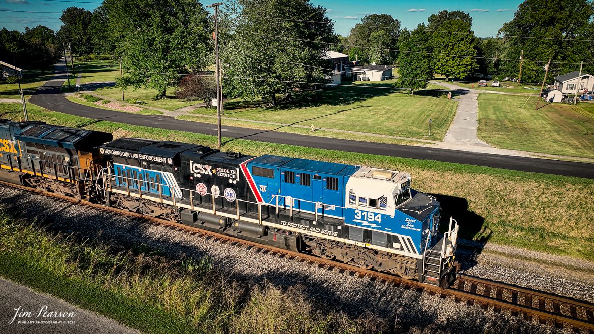 CSXT The Spirit of our Law Enforcement locomotive 3194 leads a loaded ethanol train south at Mortons Gap, Ky, on the CSX Henderson Subdivision on August 24th, 2025.

From a CSXT past Press Release: CSXT 3194 was renamed to honor our nation’s police officers who dedicate their lives to serve and protect communities across our network.

“CSX is proud of the employee craftsmanship involved in transforming this locomotive into a special commemorative engine,” says Ed Harris, executive vice president of operations. “This is a moving tribute to the men and women who serve us every day and aligns with CSX’s goal to connect military service members, first responders, and their families to the resources and support they need.”

The Spirit of our Law Enforcement joins their collection of Pride in Service locomotives that they have launched – the Spirit of our Armed Forces and the Spirit of our First Responders. When not actively moving customers – freight, the locomotives are made available for special events along the CSX system – extending our culture of service and commitment from our customers to the communities where we operate.

Tech Info: DJI Mavic 3 Classic Drone, RAW, 22mm, f/2.8, 1/1000, ISO 170

#railroad #railroads #train, #trains #railway #railway #steamtrains #railtransport #railroadengines #picturesoftrains #picturesofrailways #besttrainphotograph #bestphoto #photographyoftrains #bestsoldpicture #JimPearsonPhotography #trainsfromtheair #trainsfromadrone #onecsx #csx