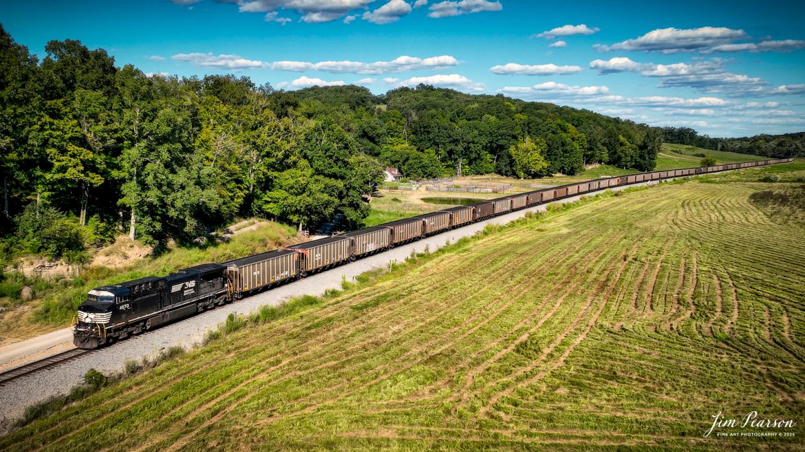 Norfolk Southern 4670 brings up the rear as DPU on a loaded coal train headed north from the Do Stop crossing, just south of Caneyville, Kentucky on the Paducah and Louisville Railway (PAL), on August 26th, 2025. Currently NS has been running a set of two of these trains on the PAL (empty Southbound and loaded Northbound) and they seem to alternate between loading at Warrior Coal Loop outside Madisonville, and Calvert City Loadout at Calvert City, Ky.

Tech Info: 4K Video Frame Grab from a DJI Mavic 3 Classic Drone.

#railroad #railroads #train, #trains #railway #railway #steamtrains #railtransport #railroadengines #picturesoftrains #picturesofrailways #besttrainphotograph #bestphoto #photographyoftrains #bestsoldpicture #JimPearsonPhotography #trainsfromtheair #trainsfromadrone #norfolksouthern