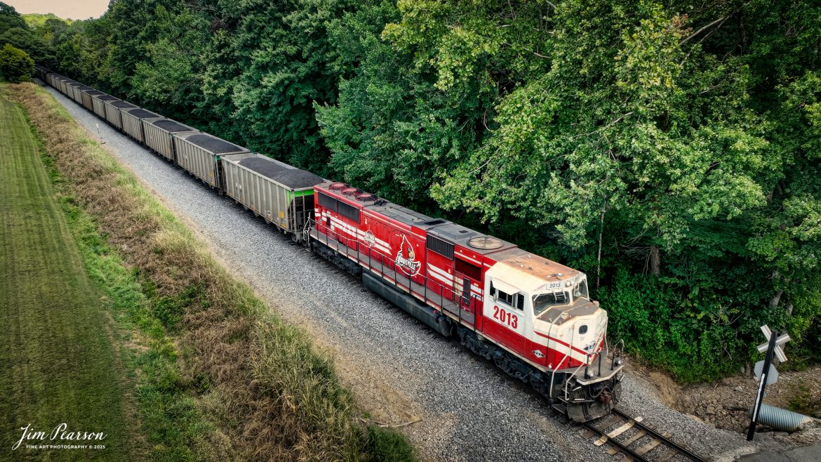 Paducah and Louisville Railway 2013 University of Louisville locomotive brings up the rear as the DPU on a northbound loaded Louisville, Gas and Electric coal train just south of Beaver Dam, Kentucky, on August 26th, 2025. 

According to Wikipedia: The Paducah & Louisville Railway (reporting mark PAL) is a Class II railroad that operates freight service between Paducah and Louisville, Kentucky. The line is located entirely within the Commonwealth of Kentucky.

The 270-mile (430 km) line was purchased from Illinois Central Gulf Railroad in August of 1986.

Tech Info:4K Video Frame Grab from a DJI Mavic 3 Classic Drone

#railroad #railroads #train, #trains #railway #railway #steamtrains #railtransport #railroadengines #picturesoftrains #picturesofrailways #besttrainphotograph #bestphoto #photographyoftrains #bestsoldpicture #JimPearsonPhotography #trainsfromtheair #trainsfromadrone #paducahandlouisvillerailway