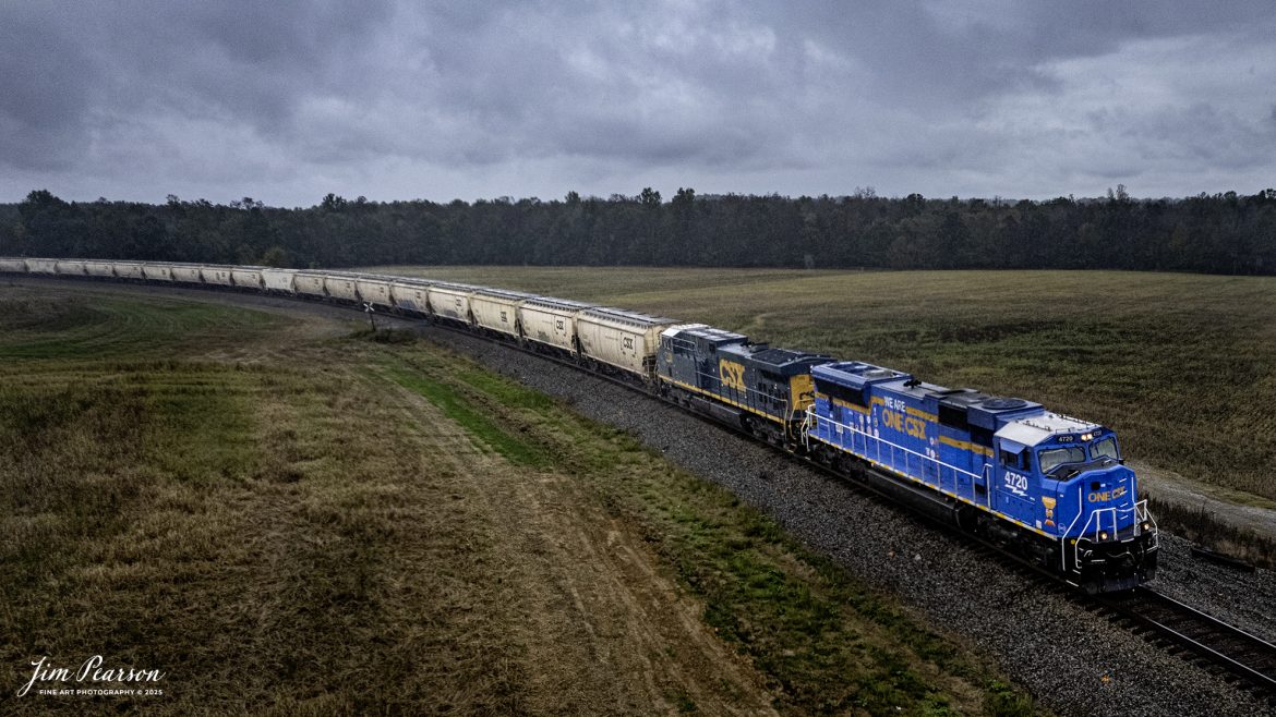 CSXT One CSX unit leads empty grain train G410 as it passes through the curve at Breton, Ky on their way north on the CSX Henderson Subdivision on October 6th, 2025, in a light rain.

According to a CSX press release, January 14, 2025 - CSX has introduced the ONE CSX locomotive, a specially designed engine to symbolize the company’s commitment to fostering collaboration, inclusion, and mutual respect across its workforce.

“This locomotive celebrates our ONE CSX team and culture,” said CSX President and Chief Executive Officer Joe Hinrichs. “I am so proud to work with 23,000 members of our ONE CSX team every day to keep America moving.”

The locomotive’s vibrant design was created by Jody Cremeans, a Carman Painter at CSX’s mechanical shop in Huntington, West Virginia. Cremeans’ design reflects the company’s cultural pillars of valuing, appreciating, including, and respecting every individual within its organization. Employees at CSX’s Waycross, Georgia, mechanical shop brought the design to life, meticulously painting and polishing the locomotive to perfection.

Prominently displayed on the locomotive are the logos of 14 labor unions that represent CSX employees, reinforcing the company’s commitment to collaboration. This special detail of the locomotive further exemplifies CSX’s focus on working together to deliver exceptional customer service while ensuring every employee feels valued and connected.

“The ONE CSX cultural initiative has been a great way for management and craft employees to come together, to work together and to value each other,” explained Jon Guest, Assistant Superintendent at the CSX Waycross Terminal.

The ONE CSX locomotive serves as a rolling tribute to the importance of teamwork and mutual respect within the organization. For CSX, its success is directly tied to creating a workplace that fosters unity and celebrates each employee’s contributions.

The new locomotive stands as a testament to the power of shared purpose within the organization and represents CSX’s aspiration to continue building an inclusive and respectful workplace.

Tech Info: DJI Mavic Air 2S Drone, RAW, 22mm, f/2.8, 1/2000, ISO 150.

#railroad #railroads #train, #trains #railway #railway #steamtrains #railtransport #railroadengines #picturesoftrains #picturesofrailways #besttrainphotograph #bestphoto #photographyoftrains #bestsoldpicture #JimPearsonPhotography #trainsfromtheair #trainsfromadrone #onecsx #csx