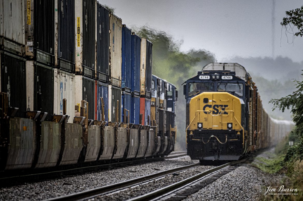CSXT 4744, waits in the siding during a light rain as northbound CSX I026 passes them at the south end of Slaughters Ky, on the CSX Henderson Subdivision on October 6th, 2025.

Tech Info: Nikon Z6ii, RAW, Sigma 150-600 @ 600mm, f/6.3, 1/800, ISO 2500

#railroad #railroads #train, #trains #railway #railway #steamtrains #railtransport #railroadengines #picturesoftrains #picturesofrailways #besttrainphotograph #bestphoto #photographyoftrains #bestsoldpicture #JimPearsonPhotography #onecsx #csx