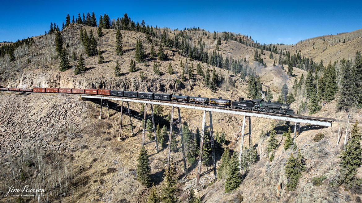 Cumbres and Toltec Scenic Railroad locomotive 487  pulls the Friends fall photo charter as they head north over Cascade Trestle out of Chama, New Mexico on October 26, 2025.

According to Wikipedia, The Cumbres and Toltec Scenic Railroad, often abbreviated as the C&TSRR, is a 3 ft (914 mm) narrow-gauge heritage railroad that operates on 64 miles (103 km) of track between Antonito, Colorado, and Chama, New Mexico, in the United States. The railroad is named for two geographical features along the route: the 10,015-foot (3,053 m)-high Cumbres Pass and the Toltec Gorge. Originally part of the Denver and Rio Grande Western Railroad's narrow-gauge network, the line has been jointly owned by the states of Colorado and New Mexico since 1970.

Tech Info: DJI Air 2Si, RAW,  at 22mm, f/2.8, 1/1500, ISO 100

#railroad #railroads #train, #trains #railway #railway #steamtrains #railtransport #railroadengines #picturesoftrains #picturesofrailways #besttrainphotograph #bestphoto #photographyoftrains #bestsoldpicture #JimPearsonPhotography #Steamtrain #c&tsrr