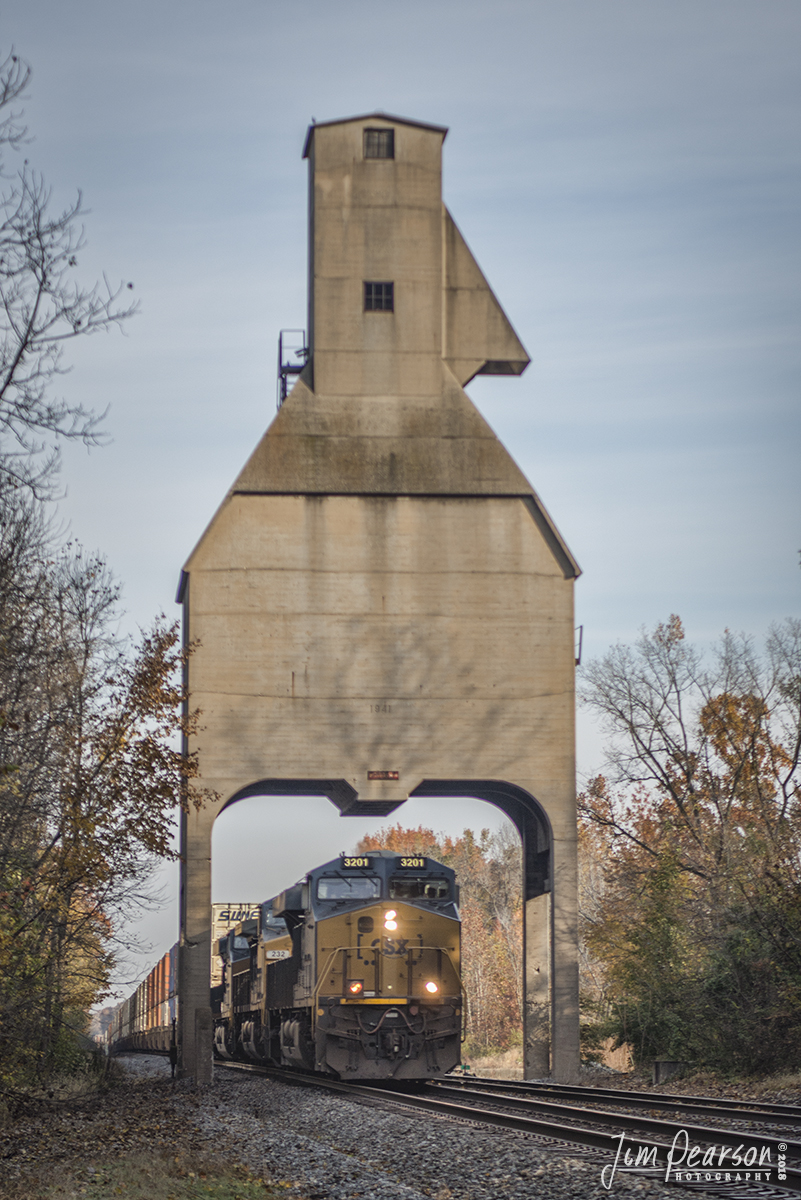 November 3, 2018 - Illuminated by the early morning sun, CSX Q029 (Chicago, IL - Atlanta, GA) heads south on CSXs CE&D Subdivision at Sullivan, Indiana, under the old C&EI coaling tower that was built in 1941 to service steam locomotives. - #jimstrainphotos #indianarailroads #trains #nikond800 #railroad #railroads #train #railways #railway #csx #csxrailroad