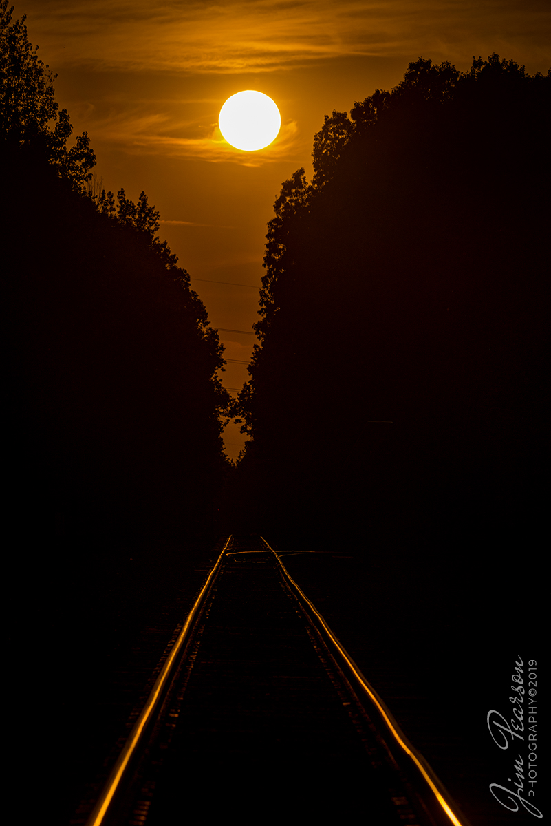 September 19, 2019 - The sun begins to set over the Paducah and Louisville Railway at the crossing from West Yard in Madisonville, Ky as we approach the first day of fall.