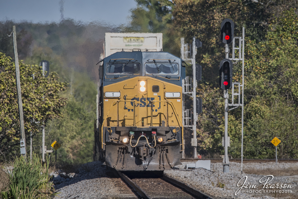 October 17, 2019 - CSXT Locomotive #1, "Spirit of West Virginia," leads Q029-16 as it crests a hill at Mortons Junction in Mortons Gap, Kentucky as it heads south on the Henderson Subdivision.

According to wvncrails.org: More so than any locomotive on the current CSXT roster, the CW44AC has been the symbol of power in the Appalachian coalfields for the past two decades. It was this model that ultimately displaced SD40-2s and other EMD products from the bulk of this type of service. Rated at 4400 HP and 145,000 pounds of tractive effort, it proved well suited for lugging coal trains through the mountains of Appalachia. In recent years, CSX has modified a portion of this fleet and reclassified them as CW44AH (high adhesion) versions.

The CW44AC has proved reliable as most that were ordered during the mid-1990s still hold a place on the roster. As newer GEs arrived on the scene in recent years, the CW44AC has become more utilitarian as it can be found in any type of service ranging from manifests to intermodals. Added to this has been the downturn in the coal industry and it----along with the newer AC models----has created a preponderance of AC traction motive power that was initially targeted for use in coal service. As a result, these locomotives are now used in all types of service which has further diminished the presence of older EMDs on the mainline.

Delivered in 1994, the locomotive that eventually became the "Spirit of West Virginia" began life on the roster as #9100. It was among fourteen units numbered 9100-9113 that were later renumbered as 1-14. CSX used this as a beginning to number the CW44ACs in sequence from #1 to what now concludes at #602. Of note are units 600-602; these were originally CW60ACs but were derated from 6000 HP to 4400 HP.  There is also another group of these locomotives on the roster with four digit numbers 5101-5122 although they have been reclassified as CW44AH models.
