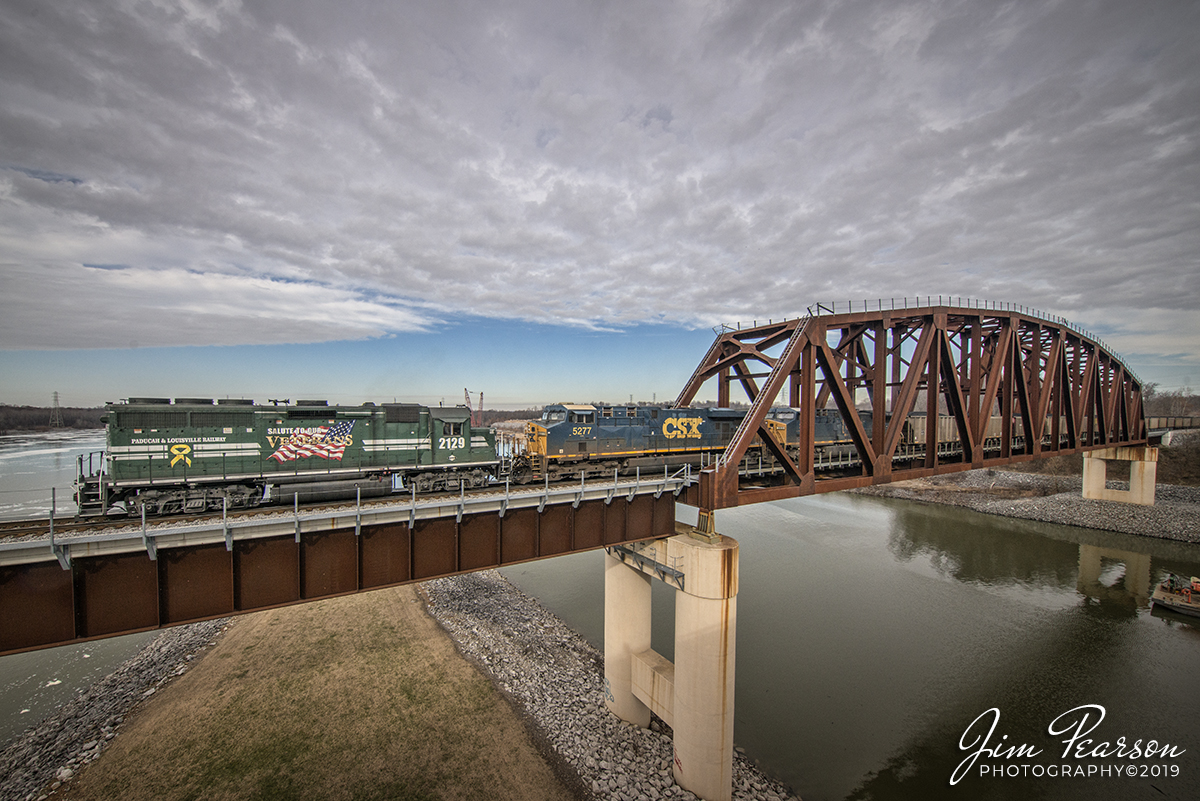 December 21, 2019 - Paducah and Louisville Railway's Salute to Our Veterans GP40-2 runs long nose forward as it crosses the bridge at Kentucky Dam at Gilbertsville, Kentucky pulling a CSX loaded coal train over the Tennessee river. They were headed south to Calvert City Terminal with their loaded train when they passed my house in Richland, Kentucky and it was very unusual to see the lash-up this way so I had to give chase!! A nice early Christmas present for me!!