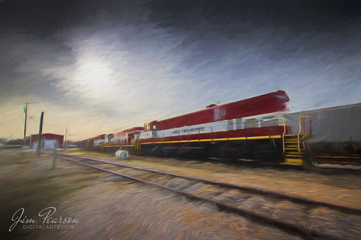 January 1, 2020 - A string on power sits next to the engine house at the West Tennessee Railroad engine house at their yard in Jackson, Tennessee on a very quiet New Years Day. From front to back are, 3576, 7855, 3560 and SCTR 483 (The Duck River Route).

According to Wikipedia: The West Tennessee Railroad (reporting mark WTNN) is a shortline railroad in the Southern U.S., connecting Corinth, Mississippi, to Fulton, Kentucky, via western Tennessee. The company began operating in 1984 on a portion of the former Mobile and Ohio Railroad (M&O) main line between Jackson and Kenton, Tennessee. 

It significantly expanded operations in 2001 through the lease, from the Norfolk Southern Railway, of the ex-M&O south to Corinth and a former main line of the Illinois Central Railroad (IC) north to Fulton, as well as a branch from Jackson to Poplar Corner (ex-Birmingham and Northwestern Railway, acquired by the Gulf, Mobile and Northern Railroad in 1924). 

All of these lines were part of the Illinois Central Gulf Railroad (ICG) prior to its 1980s program of spin-offs, during which Gibson County purchased the Jackson-Kenton line and the Southern Railway acquired the Corinth-Fulton line and Poplar Corner branch.

The company is under common control with the South Central Tennessee Railroad and the Tennken Railroad. Its main line was upgraded as part of the MidAmerica Corridor, an initiative by the Canadian National Railway and Norfolk Southern Railway to improve rail service between Illinois and the Southeast.

The Mobile and Ohio Railroad completed a line between Mobile, Alabama, and Columbus, Kentucky, in 1861, and the Mississippi Central Railroad, an Illinois Central Railroad predecessor, completed its north-south line between New Orleans, Louisiana and Cairo, Illinois in 1873. The Birmingham and Northwestern Railway opened a line between Jackson, where the M&O and IC lines crossed, and Dyersburg in 1912 and was purchased by the Gulf, Mobile and Northern Railroad in 1924. Thr