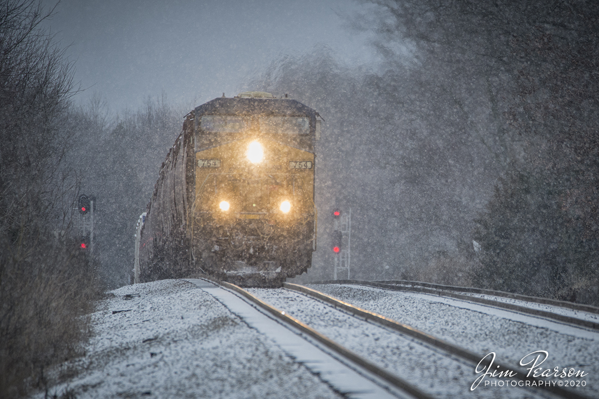 February 7, 2020 - CSXT 754 pulls CSX Q503-06 up over the rise at the north end of Crofton, Ky as it works its way south through the early morning blowing snow on the Henderson Subdivision.
