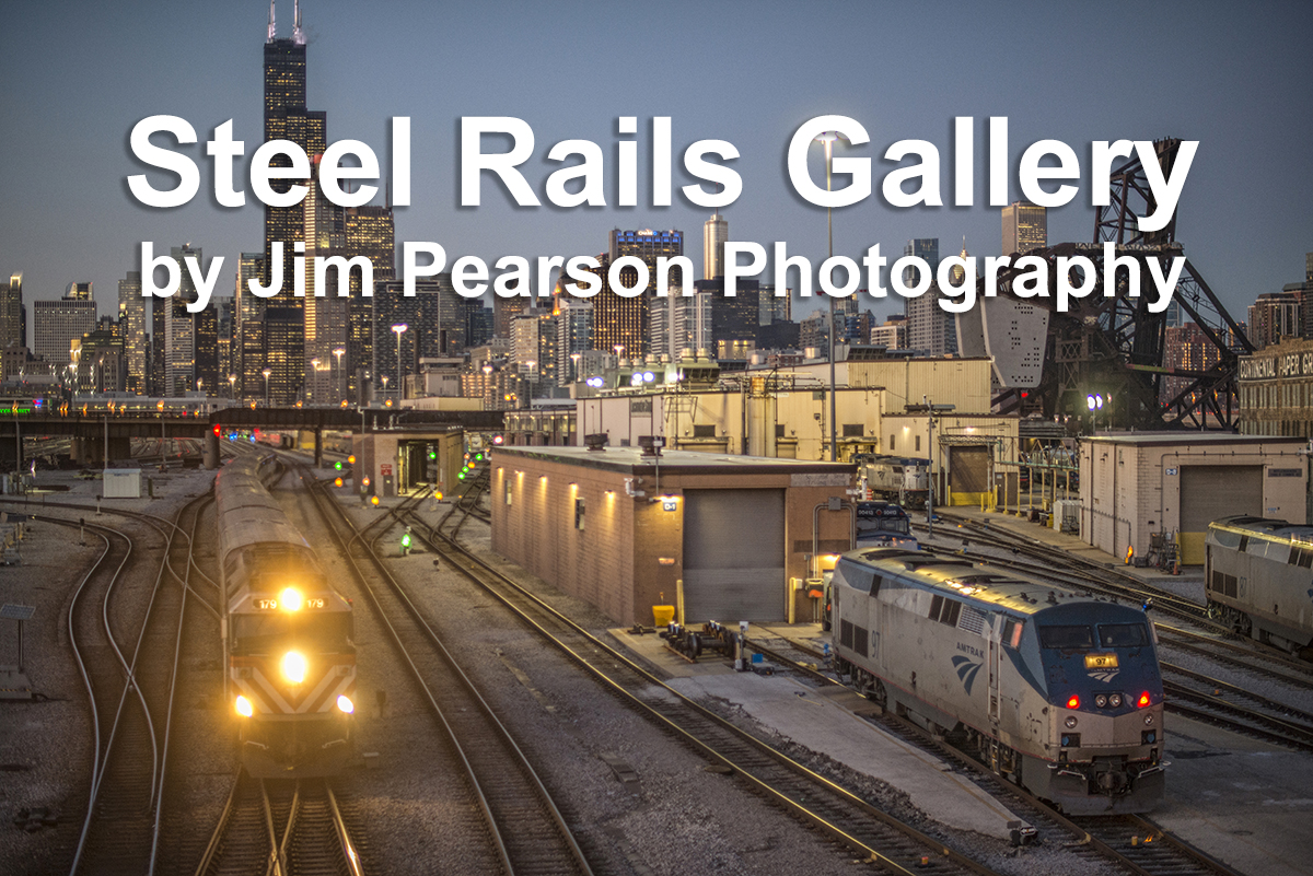 February 20, 2020 - Metra 167 pulls a southbound commuter train out of downtown Chicago, Illinois past the Amtrak facility as it approaches the 18th street overpass, as dusk falls over the city.