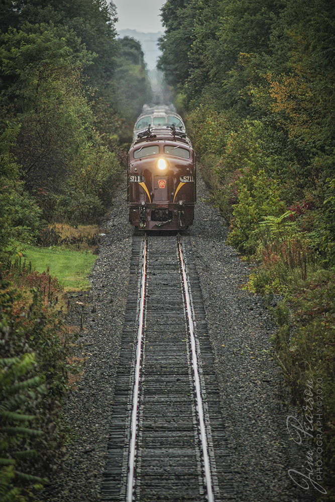 July 31, 2004- Blast From The Past - A pair of E8s, with 5711 leading, in beautiful Pennsylvania RR maroon and gold paint pulled a private car passenger train between Philadelphia and Dennison, Ohio during the Dennison Railroad Museum's 2004 Railfest. Here it is just East of Morgan Run headed away from Dennison. 

The event was in cooperation with the Ohio Central Railroad, as the museum celebrated its 15th Anniversary. It was billed as the largest railroad heritage event of 2004. 

It ran from July 30 to August 1, 2004. Many of the locomotives featured during the event were owned by the Ohio Central Railroad. The Ohio Central at that time provided full-time freight railroad services and also offered passenger excursions powered by vintage equipment. Not sure if this is still the case or not.