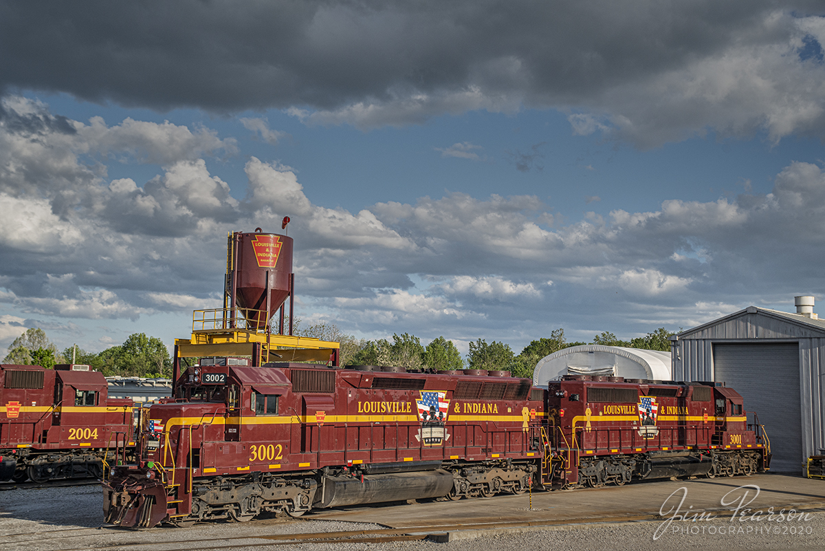 May 8, 2020 - Louisville and Indiana Railroad Honoring Our Veterans units 3001 & 3002 bask in the late evening light outside the shops at Jeffersonville, Indiana.

According to Wikipedia and the Internet: The Louisville and Indiana Railroad is a Class III railroad that operates freight service between Indianapolis, Indiana and Louisville, Kentucky, with a major yard and maintenance shop in Jeffersonville, Indiana. It is owned by Anacostia Rail Holdings. The 106-mile line was purchased from Conrail in March 1994.

The logo on the units were designed by Tyler Hardin and depicts silhouettes of three soldiers from different eras against a backdrop of the American flag. The design, framed by the LIRC keystone, includes five stars for the branches of the service and the legend Honoring Our Veterans. A soldier in the center wears a contemporary helmet, flanked by a pair of soldiers, one wearing a World War I-era Doughboy helmet and the other an M1 helmet from World War II, Korea, and Vietnam.

The locomotives are 3,000 h.p. SD40-2 units numbered 3001 and 3002, and were repainted during a recent upgrade at Metro East Industries Inc. in Fairview Heights, Ill., a suburb of St. Louis. The units are leased from CIT Rail.