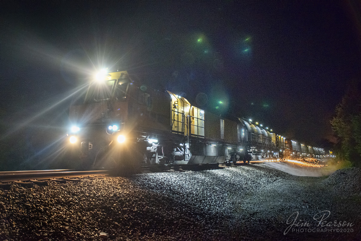 June 6, 2020 - A dazzeling lightshow breaks darkness of the night as the roar of LORAM Railgrinder 403 screaches it's way through a curve, just south of Crofton, Kentucky, as it grinds it's way south on the Henderson Subdivision on a hot and muggy spring night.

According to Wikipedia: A railgrinder (or rail grinder) is a maintenance of way vehicle or train used to restore the profile and remove irregularities from worn tracks to extend its life and to improve the ride of trains using the track.

Tech Info: Nikon D800, RAW, Sigma 24-70 @ 24mm, f/2.8. 1/125sec, ISO 2500.