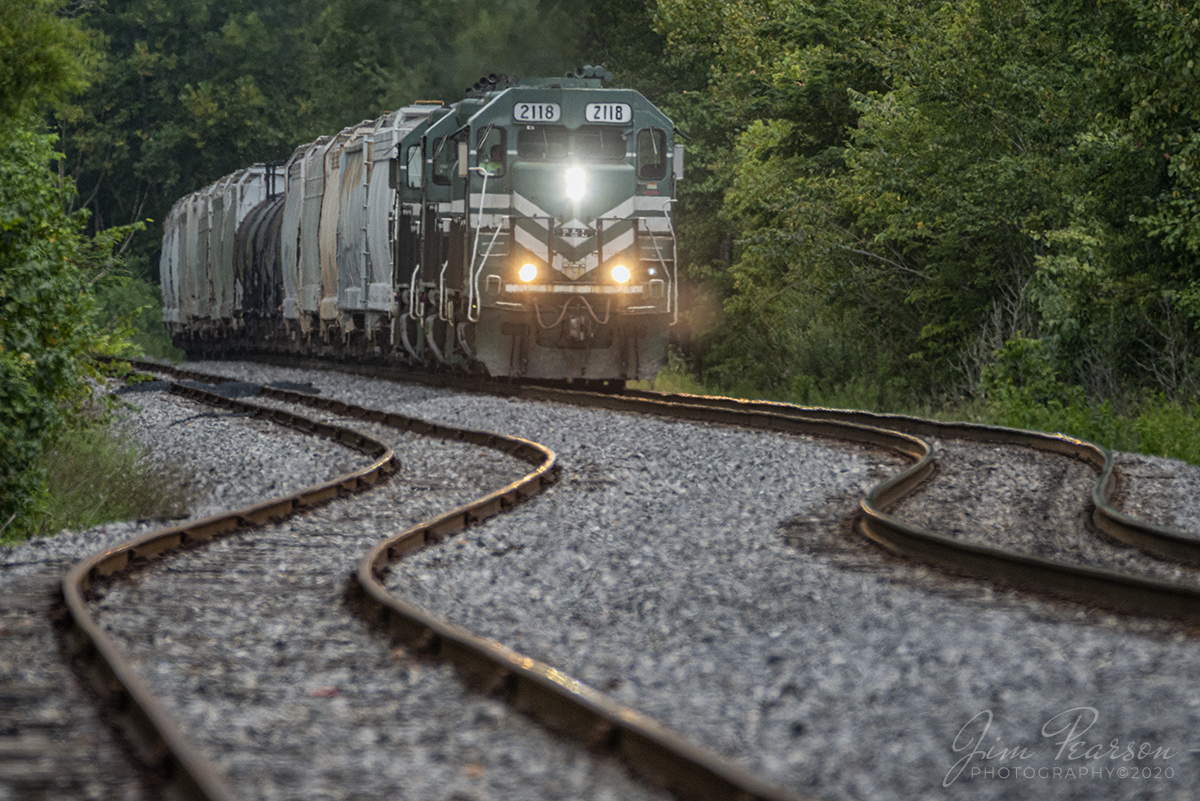 August 26, 2020 - Paducah and Louisville 2118 heads up the Princeton to Madisonville, Ky local as it heads north through Dawson Springs, Ky to Madisonville to perform interchange work with CSX at Atkinson Yard. 

I love shooting spots that have interesting track or other features that help draw the viewer's eye to the subject of the photograph, such as in this case with the two small S curves just south of the highway 62 overpass. Always look for ways to help your photographs have more impact by looking for these interesting things that can help add interest to your shots.

Tech Info: Full Frame Nikon D800, RAW, Sigma 150-600 @ 460mm, f/8, 1/800, ISO 900.