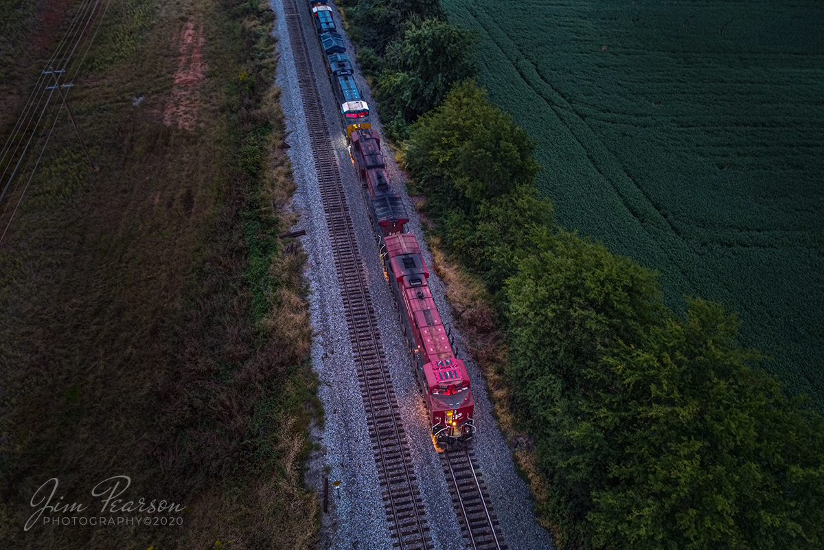 September 26, 2020 - The last shot of the day! Today was the annual outing for the West Kentucky Chapter of the National Railway Historical Society and many of us gathered at Crofton, Kentucky on the CSX Henderson Subdivision to enjoy each others company and do a bit of railfanning COVID19 style! 

I've been wanting to try a blue hour photograph from my drone and while waiting for this K422 train to finish dropping of a grain portion of the train to RJ Corman in Guthrie I decided if I was going to photograph it I'd have to drive the 20 miles from Hopkinsville, where I was around sunset if I was going to catch it.

So, talk about stability, this is a 3 second exposure taken during the blue hour of Canadian Pacific 8930 leading K422 as it waited for a NB green at the north end of Guthrie, Kentucky on the CSX Henderson Subdivision. It was shot about 20 minutes after sunset from my DJI Mavic Mini Drone. 

I shot several shots, but this is the one that I liked the best. I will say that it was also probably the sharpest one of the 6 that I shot, all at the same shutter speed. The ISO was 400. 

While the light was fading fast, as it does during the blue hour, there was enough where I could maintain line of sight with the drone.

All in all it was probably one of my best days trackside with the drone so far, with fellow railfans, where I caught 15 different shots that I'll post from this days shoot over the next couple of weeks!

Tech Info: DJI Mavic Mini Drone, JPG, 4.5mm (24mm equivalent lens) f/2.8, 3 seconds, ISO 400.