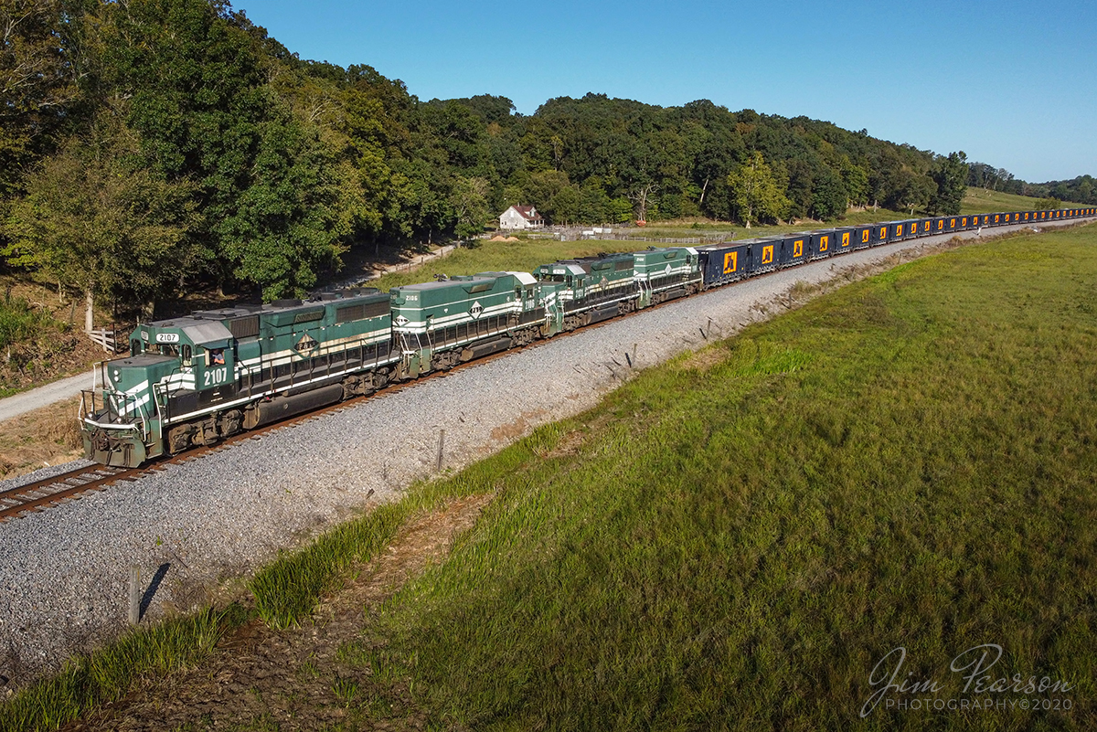 May 13, 2020  Paducah and Louisville Railway (PAL) 2107, leads LV1, a Scottys Rock train, south with PAL 2106, 2121 and 2100 trailing, as they roll through the valley at Caneyville, Kentucky, after picking a load of rock cars from Scottys Contracting & Stone at Litchfield, bound for their Madisonville operation.

Tech Info: DJI Mavic Mini Drone, JPG, 4.5mm (24mm equivalent lens) f/2.8, 1/1250, ISO 100.