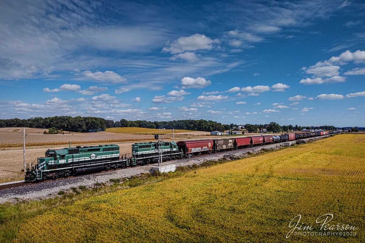 October 3, 2020 - Evansville Western Railway 6001 and 6002 lead a local freight past the siding at Abee, Indiana as they approach the Wildeman Road Crossing on their way back to Mount Vernon, IN after doing interchange work with CSX at Howell Yard in Evansville, IN.

Tech Info: DJI Mavic Mini Drone, JPG, 4.5mm (24mm equivalent lens) f/2.8, 1/1600, ISO 100.