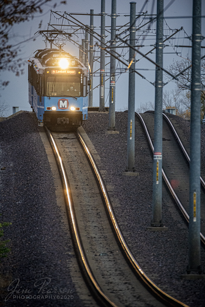 Over the Hump!

With darkness fast approaching MetroLink 110 heads down their overpass at the Alton Southern Railway in East St. Louis, Missouri as their train set heads to their barn from Lambert Airport.

According to Wikipedia: MetroLink (reporting mark BSDA) is the Greater St. Louis Metropolitan mass transit system serving Missouri and the Metro East area of Illinois. The system consists of two lines (Red Line and Blue Line) connecting St. Louis Lambert International Airport and Shrewsbury, Missouri with Scott Air Force Base near Shiloh, Illinois, Washington University, Forest Park, and Downtown St. Louis.

The system features 38 stations and is the only light rail system in the country to cross state lines. As of the first quarter of 2015, it is second only to Minneapolis Metro Transit's Blue and Green lines in the Midwestern United States in terms of ridership, and is the 11th-largest light rail system in the country.

Tech Info: Nikon D800, RAW, Sigma 150-600 @600mm, f/6.3, 1/160, ISO 2,800.