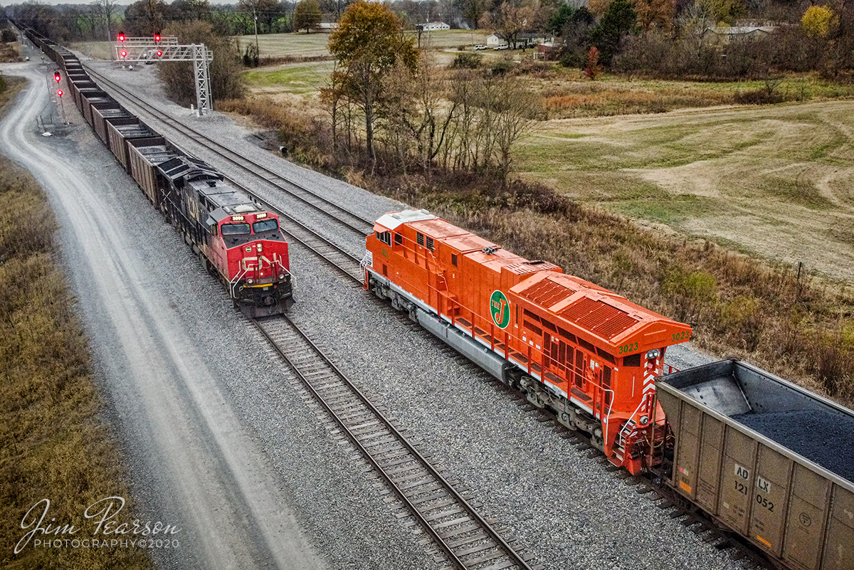 CN U700 waits for a northbound empty coal

With a fresh crew on board, Canadian National 3023, the new Elgin Jolliet & Eastern Heritage unit, (EJ&E) waits for an incoming empty coal train to get into the siding at CP South Oaks in Fulton, Kentucky before heading on south with U700, a loaded Pet Coke Train, on CNs Bluford subdivision at Fulton, Kentucky on November 21st, 2020.

According to a press release from CN: This is one of six locomotives representing the railways that have joined their team since their privatization, 25 years ago. Each one features the colors of the railway at the time it merged with CN as well as the logo specially created to commemorate the quarter century of our IPO. These acquisitions propelled our service farther than any other North American railway, similar to our IPO propelled CN to new heights. The engines release so far are 3115 BC Rail; 8952 Grand Trunk Western; 8898 CN; 3008 Illinois Central; 3069 Wisconsin Central; and 3023 Elgin, Joliet & Eastern.

Tech Info: DJI Mavic Mini Drone, JPG, 4.5mm (24mm equivalent lens) f/2.8, 1/120, ISO 400.