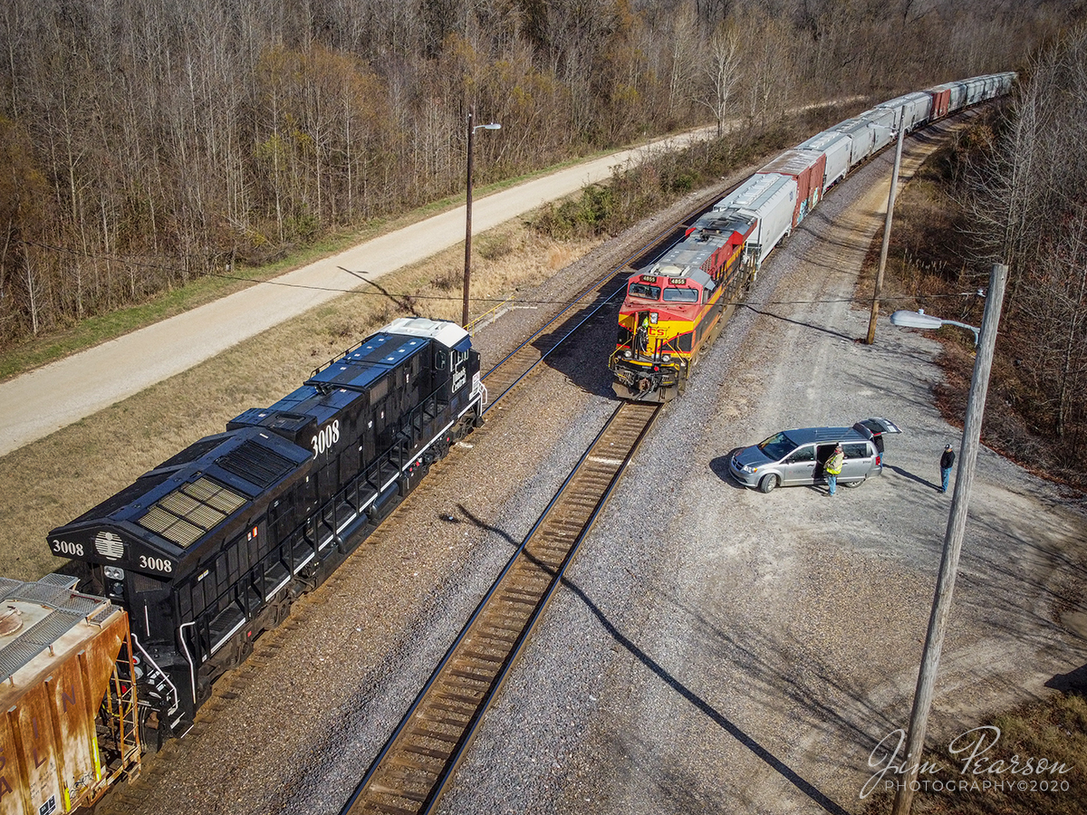 CN Illinois Central Heritage Unit meets KCS at Dexter, MO

Canadian National (CN) Illinois Central Heritage Unit 3008 passes a crew change on a SB crew change on a KCS unit, as it leads empty oil train; ONUCS-01 north on Union Pacific's Chester Subdivision, after making its own crew change at the Union Pacific Terminal at Dexter, Missouri on December 2nd, 2020.

Tech Info: DJI Mavic Mini Drone, JPG, 4.5mm (24mm equivalent lens) f/2.8, 1/1000, ISO 100.