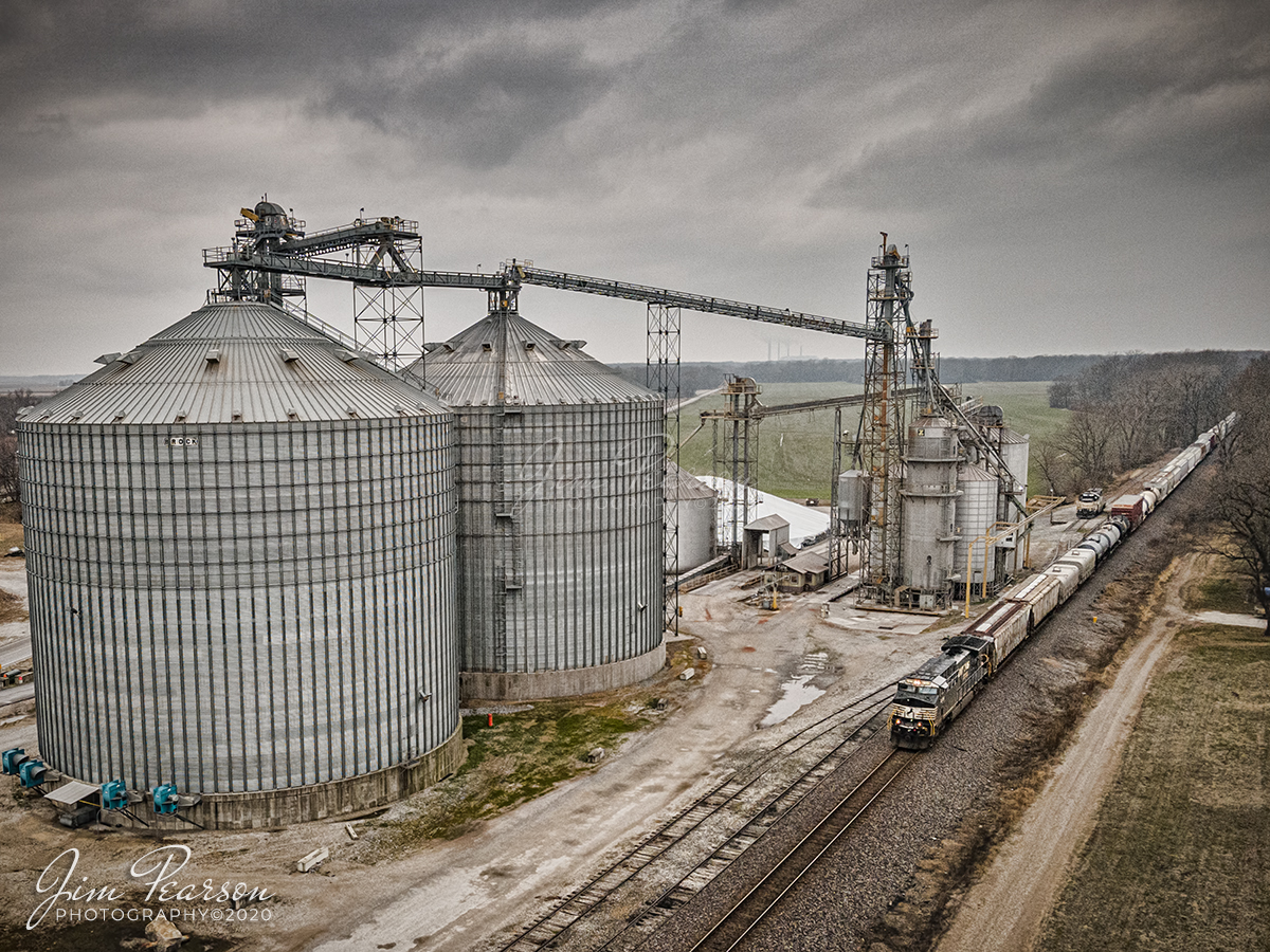 Eastbound NS freight at Lyles Station, Indiana

A Norfolk Southern mixed freight passes the Consolidation Grain and Barge Company complex at Lyles Station, as it heads east toward Princeton, Indiana. 

According to Wikipedia: "Lyles Station is an unincorporated community in Patoka Township, Gibson County, Indiana. The community dates from 1849, although its early settlers first arrived in the 1830s, and it was formally named Lyles Station in 1886 to honor Joshua Lyles, a free African American who migrated with his family from Tennessee to Indiana around 1837. 

Lyles Station is one of Indiana's early black rural settlements and the only one remaining. The rural settlement reached its peak in the years between 1880 and 1912, when major structures in the community included the railroad depot, a post office, a lumber mill, two general stores, two churches, and a school. By the turn of the twentieth century, Lyles Station had fifty-five homes, with a population of more than 800 people. 

The farming community never fully recovered from the Great Flood of 1913, which destroyed much of the town. Most of its residents left for economic reasons, seeking opportunities for higher paying jobs and additional education in larger cities. By 1997 approximately fifteen families remained at Lyles Station, nearly all of them descended from the original settlers."

Tech Info: DJI Mavic Air 2 Drone, JPG, 4.5mm (24mm equivalent lens) f/2.8, 1/320, ISO 100.