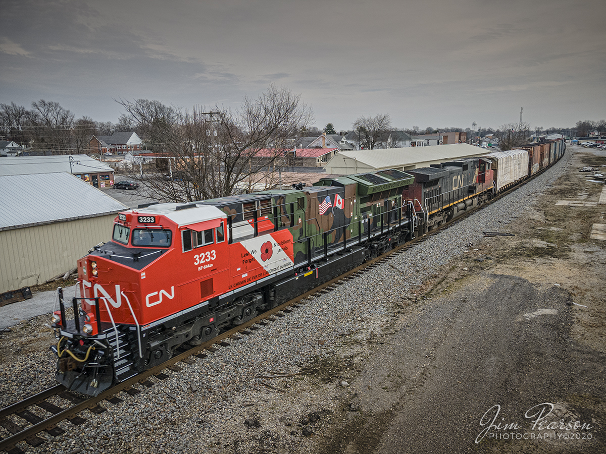 Canadian National Support our Troops engine at Anna, IL

Canadian National (CN) locomotive 3233 (Support our Troops) heads north on the CN Centralia Subdivision leading CN M396 passes through Anna, Illinois on December 15th, 2020.

From a CN Press Release: "CNs two new tribute locomotives (CN 3233 & 3015) pay homage to veterans and active military men and women across North America. Their custom design represents the proud footprint we have established across our network and our deep recognition for the veterans who live and work in the communities our trains pass through every day. Stay tuned as they make their debut on our main line in the coming days!"

Tech Info: DJI Mavic Air 2 Drone, JPG, 4.5mm (24mm equivalent lens) f/2.8, 1/500, ISO 100.