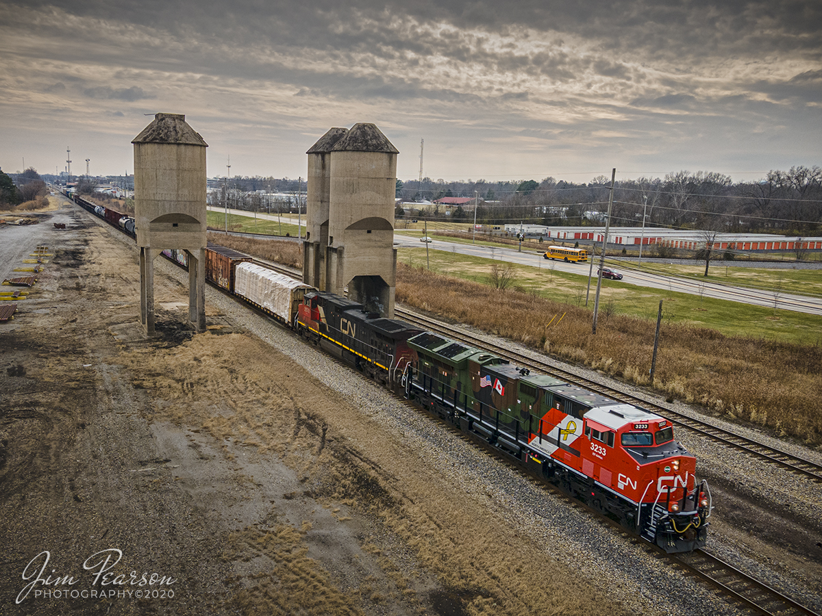 Canadian National Support our Troops Engine 3233 at Carbondale, IL

Canadian National (CN) locomotive 3233 (Support our Troops) heads north on the CN Centralia Subdivision leading CN M396 as it spits the old Illinois Central Coaling towers at Carbondale, Illinois on December 15th, 2020.

From a CN Press Release: "CNs two new tribute locomotives (CN 3233 & 3015) pay homage to veterans and active military men and women across North America. Their custom design represents the proud footprint we have established across our network and our deep recognition for the veterans who live and work in the communities our trains pass through every day. Stay tuned as they make their debut on our main line in the coming days!"

Tech Info: DJI Mavic Air 2 Drone, JPG, 4.5mm (24mm equivalent lens) f/2.8, 1/500, ISO 100,  (for detail in the highlights).