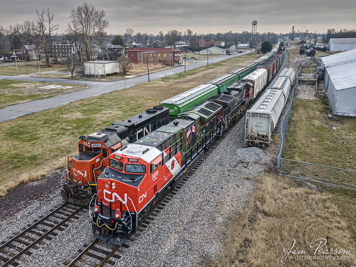 Canadian National meet at Mounds, IL

Canadian National (CN) locomotive 3233 (Support our Troops) heads north on the CN Centralia Subdivision leading CN M396 as it passes a local working at Mounds, Illinois on December 15th, 2020.

From a CN Press Release: "CNs two new tribute locomotives (CN 3233 & 3015) pay homage to veterans and active military men and women across North America. Their custom design represents the proud footprint we have established across our network and our deep recognition for the veterans who live and work in the communities our trains pass through every day. Stay tuned as they make their debut on our main line in the coming days!"

Tech Info: DJI Mavic Air 2 Drone, JPG, 4.5mm (24mm equivalent lens) f/2.8, 1/400, ISO 100.