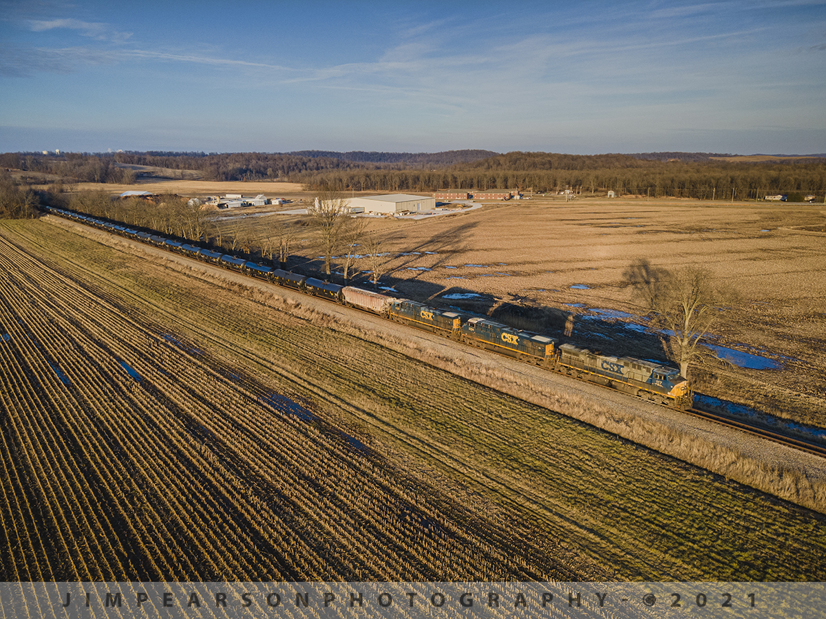 Southbound CSX K423 at Sebree, Ky

CSXT 117 in YN2 paint leads 5294 and 5280 as they move loaded ethanol train K423-05 southbound out of Sebree, Kentucky on the Henderson Subdivision as the low light from the setting sun rakes shadows across the rolls of harvested corn and the cars on it's train.

Tech Info: DJI Mavic Air 2 Drone, RAW, 4.5mm (24mm equivalent lens) f/2.8, 1/500, ISO 100.