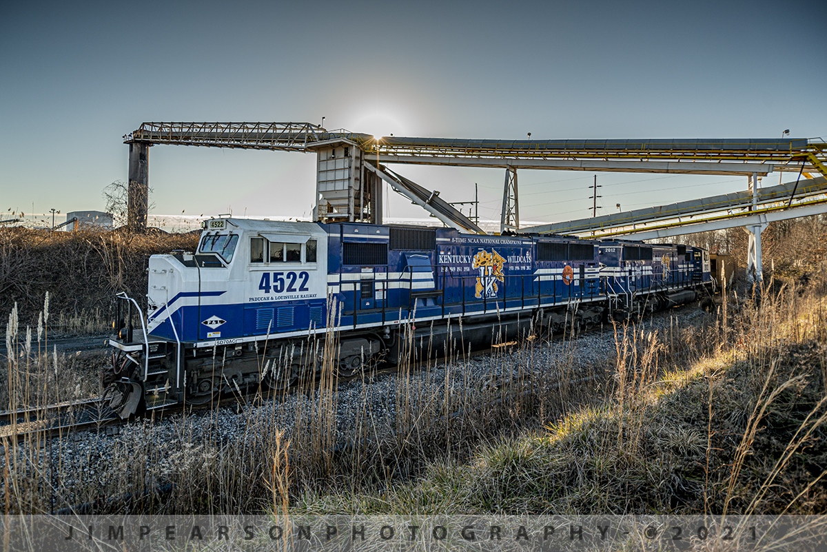 PAL Blue picking up black coal!

Paducah and Louisville Railway University of Kentucky (Wildcats) locomotives 4522 and 2012 lead a empty coal under the beltline against the setting sun as they arrive at Warrior Coal Loop in Nebo, Kentucky for another load of black coal on January 23rd, 2021.

Tech Info: Nikon D800, RAW, Nikon 10-24mm DX Lens @15mm f/4, 1/1000, ISO 180.
