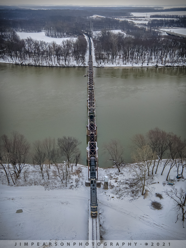 NS 8173 leads loaded coal train across the Wabash River

I was about 14 degrees, with an even colder wind chill, as Norfolk Southern 8173 crossed over the Wabash River coming into Mt. Carmel, Illinois with load of coal for the Gibson Generating Station (Duke Energy) on February 13th, 2021 on the NS Southern West District.

Today was probably the coldest day I've flown my DJI Air 2 since I bought it last year and it handled the weather just fine. I did seem to notice that the flight time on the battery was less, but I expected that to be the case. Also, the gray color of the drone against the gray snowy skies is a little harder to keep track of in the air, but not flying it too far from my position helped! 

Any of my drone friends ever use any of the orange props? If so does it help with visibility? What other things do you do to help with visibility? Strobe lights? If so, what do you recommend?

Tech Info: DJI Mavic Air 2 Drone, RAW, 4.5mm (24mm equivalent lens) f/2.8, 1/500, ISO 100.