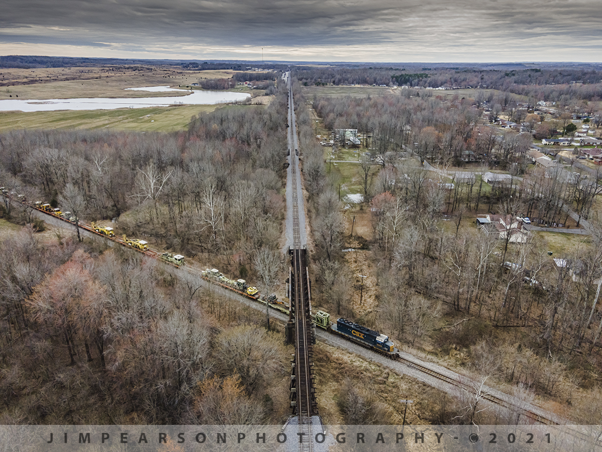 CSX MOW train northbound at Monarch, Madisonville, Ky

CSXT 8060 leads CSX W035, a loaded Maintenance of Way train, under the Paducah and Louisville Railway at Monarch as it heads north on the CSX Henderson Subdivision at Madisonville, Kentucky on March 13th, 2021 under winter cloudy skies.

Tech Info: DJI Mavic Air 2 Drone, RAW, 4.5mm (24mm equivalent lens) f/2.8, 1/640, ISO 100.