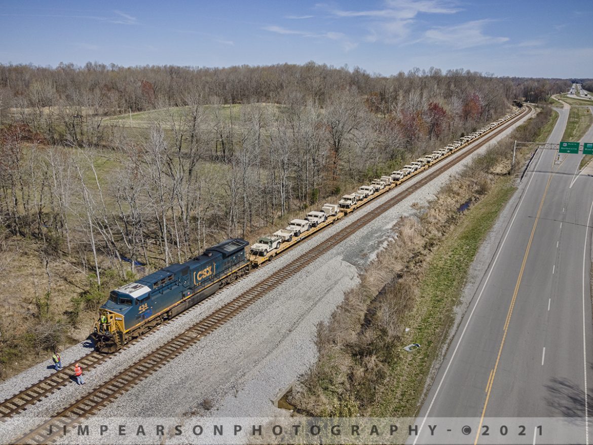 CSX W809 waits with its military load at Nortonville, Ky


The crew on southbound military train W809 waits just north of the signals at Romney on March 30th, 2021 as they chat with a member of a track crew that is welding on the switch here on the CSX Henderson Subdivision, out of frame to the left. 

Not only are they waiting for the track crew, but they were also waiting on the arrival of hot intermodal, CSX Q025, which will be coming from the north around the curve in the distance, which was still several miles away.

Tech Info: DJI Mavic Air 2 Drone, RAW, 4.5mm (24mm equivalent lens) f/2.8, 1/800, ISO 100.