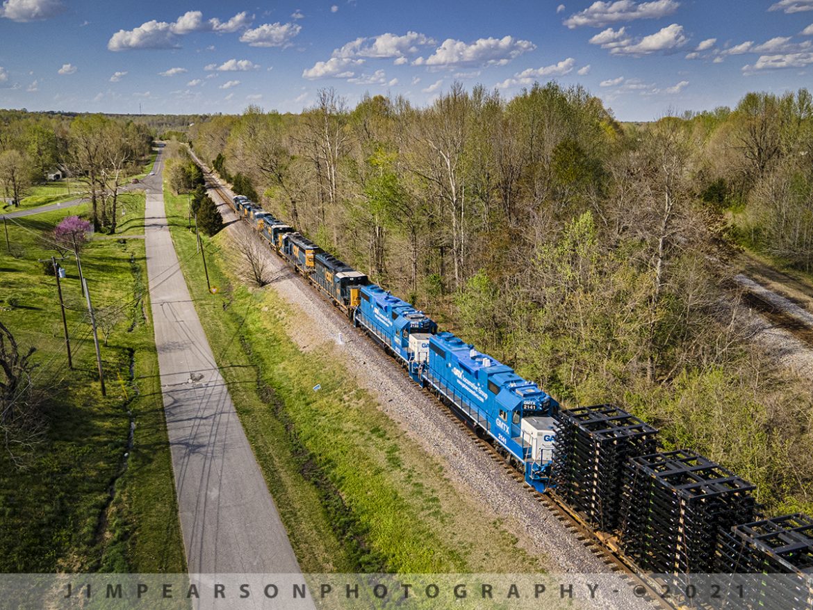 CSX Q512-09 south at Mortons Gap, Ky with 7 units

CSX Q512 with another string of seven locomotives that had GMTX 2141 and 2133 trailing as the last units, make their way downgrade from Mortons Junction at Mortons Gap, Kentucky on April 8th, 2021 as they head south on the Henderson Subdivision.

Q512 was running on this beautiful spring day with CSXT 5312, 711, 4329, 8851, 4226, GMTX 2133, 2141 as power and was 10,590 feet long. I didn't really notice, but I'm fairly sure the last 4 units weren't running. The loads behind the power are truck frames.

Tech Info: DJI Mavic Air 2 Drone, RAW, 4.5mm (24mm equivalent lens) f/2.8, 1/1000, ISO 100.