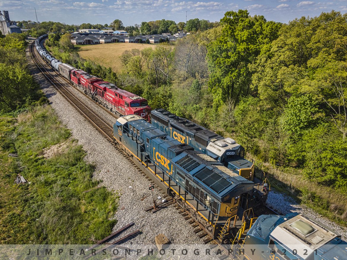 Two way meet at Courland, TN on the CSX Henderson Subdivision

A southbound CSX K423 passes a northbound CSX E002 at Courtland, Tennessee as they head their separate ways on the Henderson Subdivision on April 19th, 2021.

The southbound K423 was headed up by a SD40-2 leading, with two Canadian Pacific units, pulling a loaded ethanol train and the NB E002 was a 12,500ft empty coal train (actually two trains joined together) with two DPUs in the middle.

Tech Info: DJI Mavic Air 2 Drone, RAW, 4.5mm (24mm equivalent lens) f/2.8, 1/640, ISO 100.