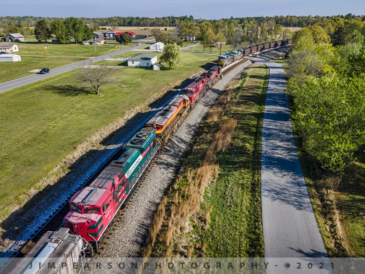 A rainbow of power waits at Kelly, Ky for a loaded coal to pass

The early morning sun sends shadows and beautiful light across this scene, as CSX K442-19 waits in the siding at the north end of the siding at Kelly, Kentucky, with Canadian Pacific 8519, 9359, KCS 4699 and Ferromex 4054 as power, for loaded CSX coal train N040 to clear the way on April 20th, 2021.

K442 was a combined empty ethanol train, heading back north on the CSX Henderson Subdivision with a length of 12,500 feet and with that length, there were only a few places along the line between Nashville, TN and Evansville, IN where they could meet other trains, and Kelly siding is one of those spots.

Id been following the progress of this train for a couple days and thanks to a heads up from fellow railfan Reed Reding about it being north of Nashville and then another railfan, Steve Miller that it was passing through Hopkinsville, Ky I decided it was time to get dressed (about 7:30am) and head south to find this interesting move! About 20 miles later I found it waiting in the siding at Kelly in plenty of time to catch it and then chase it back to Madisonville, catching it a few more times!

Thanks to Reed and Steve, along with all the other railfans along the lines with updates!! This shot wouldnt have happened without you!!

Tech Info: DJI Mavic Air 2 Drone, RAW, 4.5mm (24mm equivalent lens) f/2.8, 1/640, ISO 100.