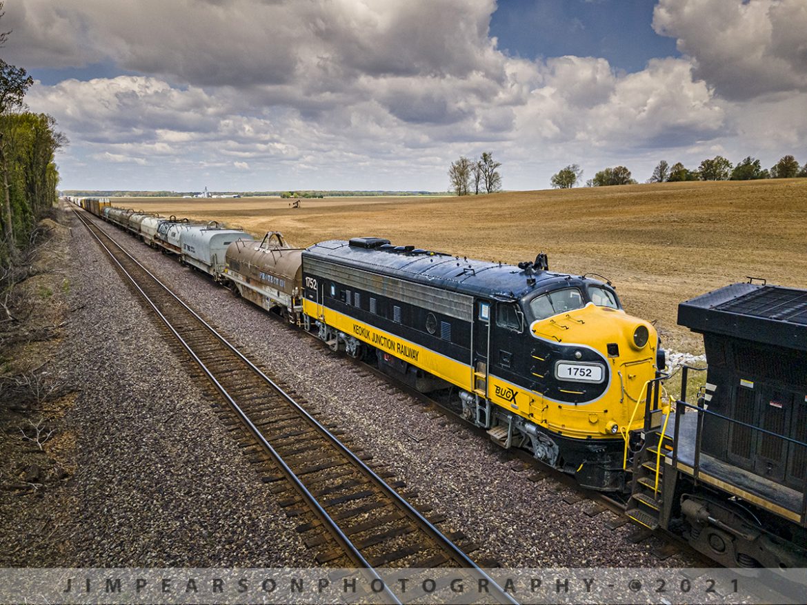 BUGX on the move!

BUGX 1752, a former Canadian National FP9A unit, which was recently sold by Pioneer RailCorp affiliate Keokuk Junction Railway, trails as the last unit on Norfolk Southern Railways train 167 as it sits at "Smoot" just west of Princeton, Indiana on April 21st, 2021, waiting to meet two eastbound trains on the NS Southern East/West District.

The unit was on the final leg of its journey to a new home at the Ohio Scenic Railway in Tell City, Indiana, where it will power their tourist line trains that runs through Perry and Spencer Counties in southern Indiana.

This was without a doubt the longest and shortest chase I've done in a long time!

I started from my home in Richland, KY to travel to Princeton, IN to meet up with fellow railfan Ryan Scott to catch this train. Well, after the 1.5hr drive and hoping I hadn't missed it, I finally linked up with Ryan, who had been sitting a couple hours west of Princeton, waiting to catch it also!

Well, needless to say, we were worried that we'd missed it somehow as it was last reported around Centralia, IL at 8am and the trip to Princeton normally takes a couple hours and by the time I linked up with Ryan it had been close to 4!

Ryan jumped in with me (I like to drive) and we decided to head west looking for the train and low and behold, we found it in the siding at Smoot, just west of town!

Well, it sat there for two west bounds before it headed into the yard for a crew change at Ohio Street. After the crew change, they had to do their work, where they dropped off one engine, picked up three more and then two exceptionally long stings of cars! Needless to say, it was 6pm before they finished their work, moved to East Junction where they where they had to wait for two more west bounds!! A total of 6 hours to move about 6 miles, but finally they made their way out of town to Huntingburg where they dropped of the FP9A unit for a local to take it to Tell City. Some days railfanning is like this!

Tech Info: DJI Mavic Air 2 Drone, RAW, 4.5mm (24mm equivalent lens) f/2.8, 1/1600, ISO 100.