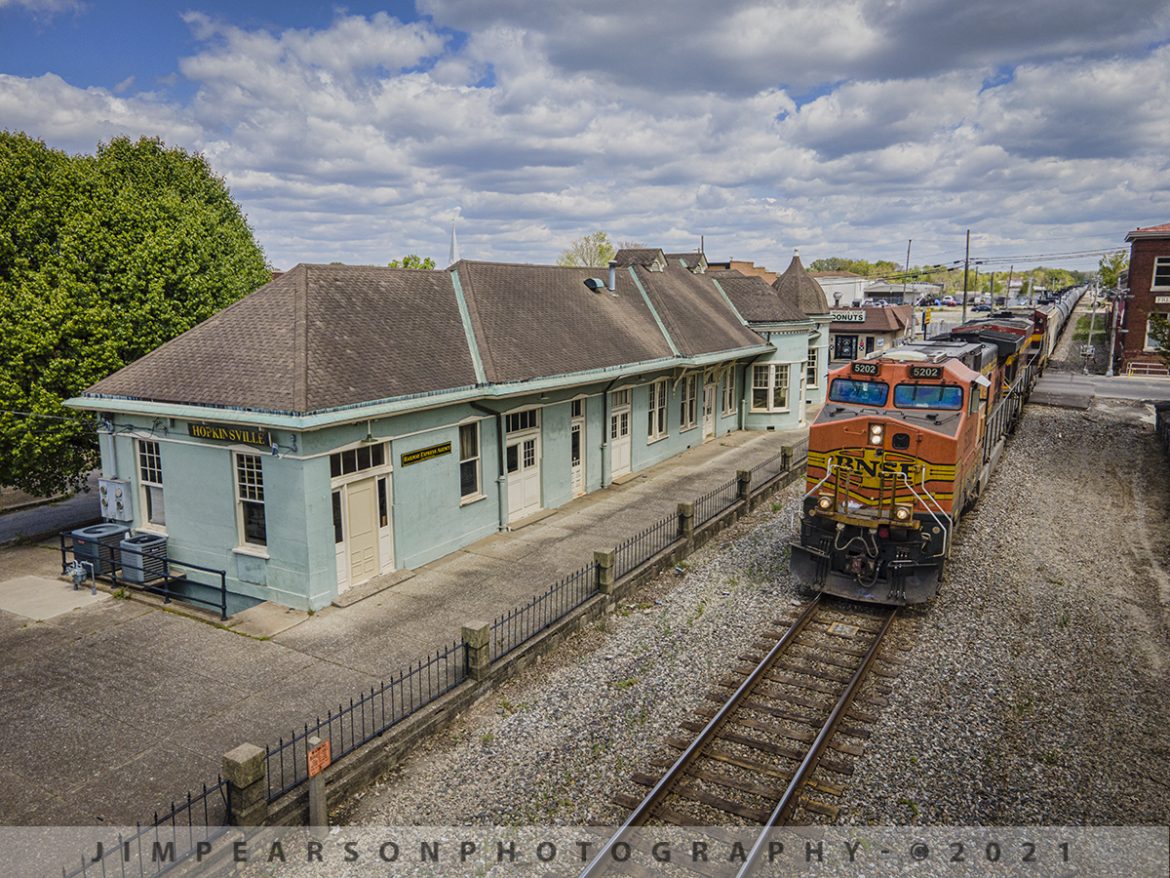 CSX K443 southbound at Hopkinsville, Kentucky on the Henderson Subdivision

A fellow railfan Frank Knight sent me a heads up on this train as it passed through Henderson, Ky early this morning on April 22nd, 2021 and here we find it passing the old Louisville and Nashville Depot in downtown Hopkinsville, Kentucky with BNSF 5202 and KCS 4677 leading a loaded ethanol train south.

I tried catching this train at the south end of Slaughters, Hanson and at Nortonville, but ended up arriving at each of my spots as the train was passing through them! It seemed like every traffic light was red and every car that drove 10mph under the speed limit was between me and my next spot!! It happens sometimes and while I didn't get the shots I wanted at each of those locations, I did at several others! Sometimes you must be persistent! 

Tech Info: DJI Mavic Air 2 Drone, RAW, 4.5mm (24mm equivalent lens) f/2.8, 1/640, ISO 100.