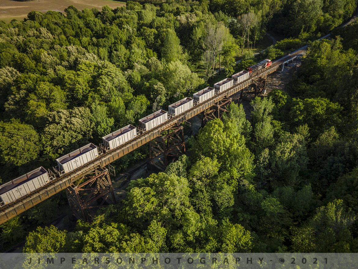CN U72481-05 southbound with a load of Iron Ore at West Paducah, KY

Canadian National U72481-05 heads southbound over the Ohio River bridge between Metropolis, IL and West Paducah, KY carrying a load of Iron ore from Keenan, MN to Convent, LA on the CN Bluford Subdivision.

According to Wikipedia: The Mesabi Iron Range is a mining district in northeastern Minnesota following an elongate trend containing large deposits of iron ore. It is the largest of four major iron ranges in the region collectively known as the Iron Range of Minnesota. First described in 1866, it is the chief iron ore mining district in the United States. The district is located largely in Itasca and Saint Louis counties. It has been extensively worked since 1892 and has seen a transition from high-grade direct shipping ores through gravity concentrates to the current industry exclusively producing iron ore (taconite) pellets.

There are three iron ranges in northern Minnesota, the Cuyuna, the Vermilion, and the Mesabi. Most of the world's iron ore, including that contained in northern Minnesota, was formed during the middle Precambrian period.

Tech Info: DJI Mavic Air 2 Drone, RAW, 4.5mm (24mm equivalent lens) f/2.8, 1/500, ISO 100.