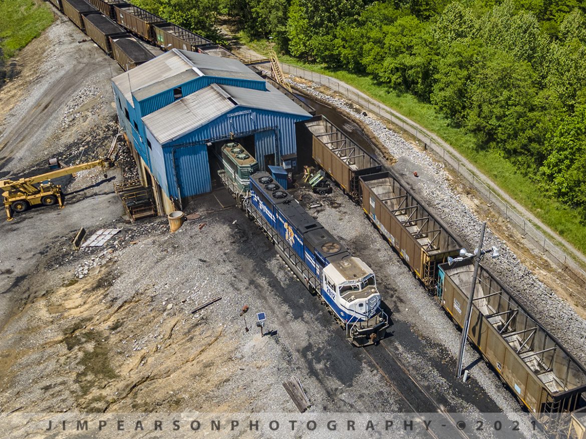 Paducah and Louisville Railway unloads at Calvert City Terminal, Ky

Paducah and Louisville Railways specialty painted University of Kentucky unit 2012 leads a loaded coal train through the unloading pit at Calvert City Terminal as it prepares to unload its coal on May 7th, 2021 at Calvert City, Kentucky.

Calvert City Terminal is located at Mile 14 on the lower Tennessee River, near its confluence with the Ohio River, Calvert City Terminal is strategically located on the Paducah and Louisville Railroad in a large industrial park at Calvert City, Kentucky. This central location provides ready access to BNSF, CNIC, UP, NS, and CSX railroads, as well as the Tennessee, Cumberland, Ohio, and Mississippi Rivers.

Tech Info: DJI Mavic Air 2 Drone, RAW, 4.5mm (24mm equivalent lens) f/2.8, 1/500, ISO 100.